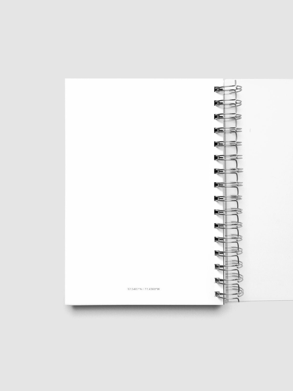 Spiral Notebook dashboard in the color Le Blanc shown in size A5 inside a notebook.