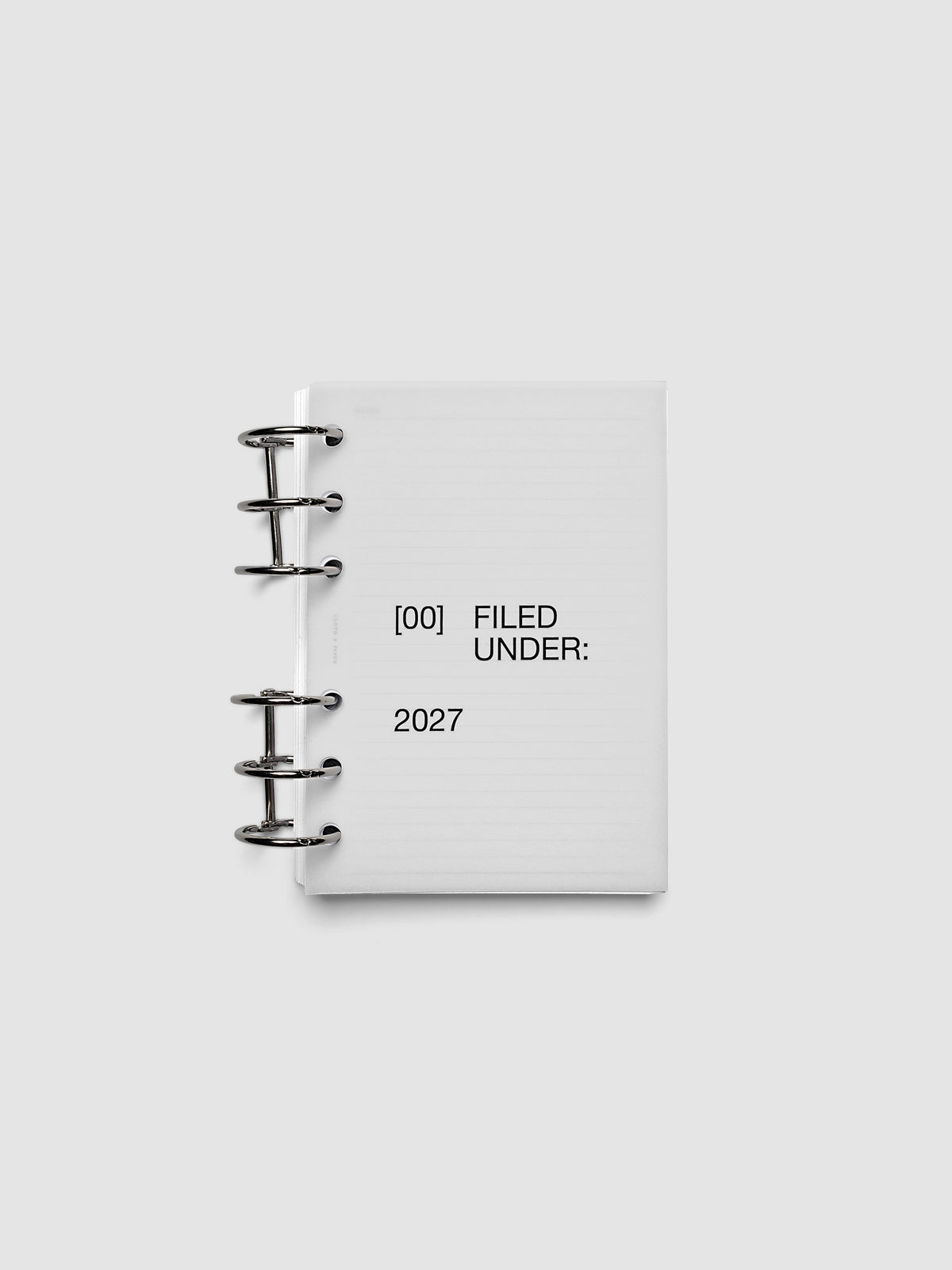 2027 Front + Monthly Dashboard Overlays, Avant Garde, A6 6-Ring Punch, vellum dashboard overlay shown layered inside a planner