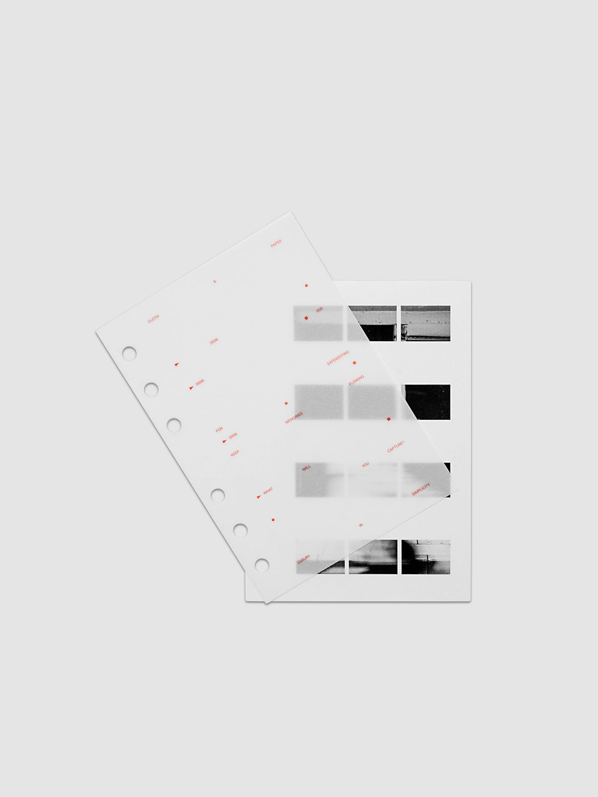 Film Strip Planner Dashboard Duo A6 6-Ring Punch two dashboards offset showing layered vellum and film strip plastic with deep orange printed details
