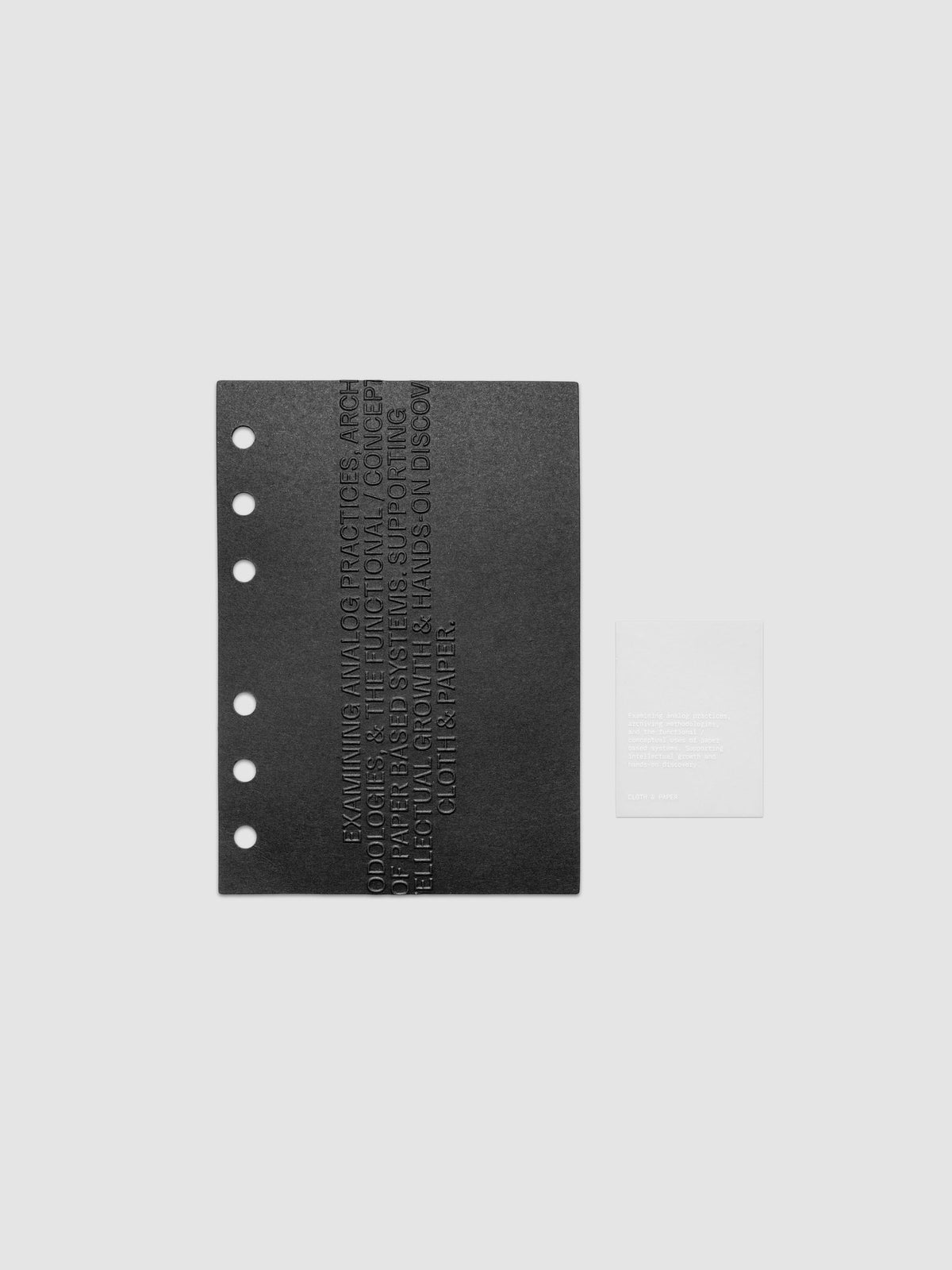 Black embossed Analog Embossed Planner Dashboard with drop card shown in size A6.