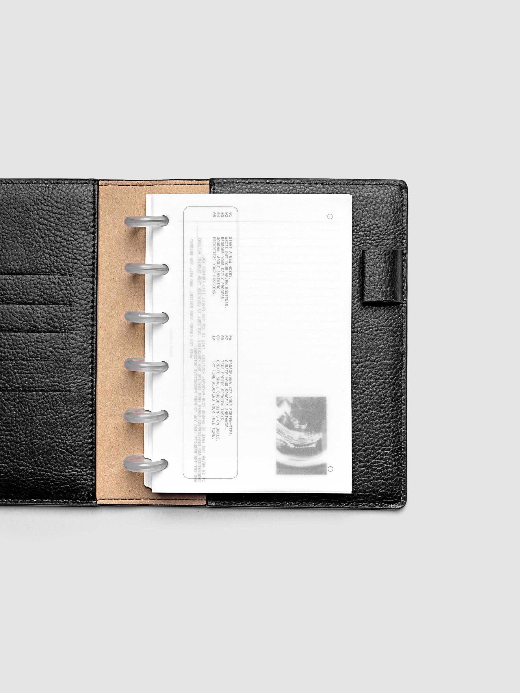 Side A & Side B Planner Dashboard in size CP Petite shown in a black folio.