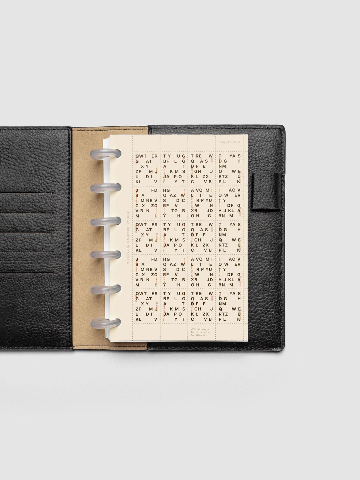 Stamp Sheet Planner Dashboard shown in a CP Petite black leather folio.