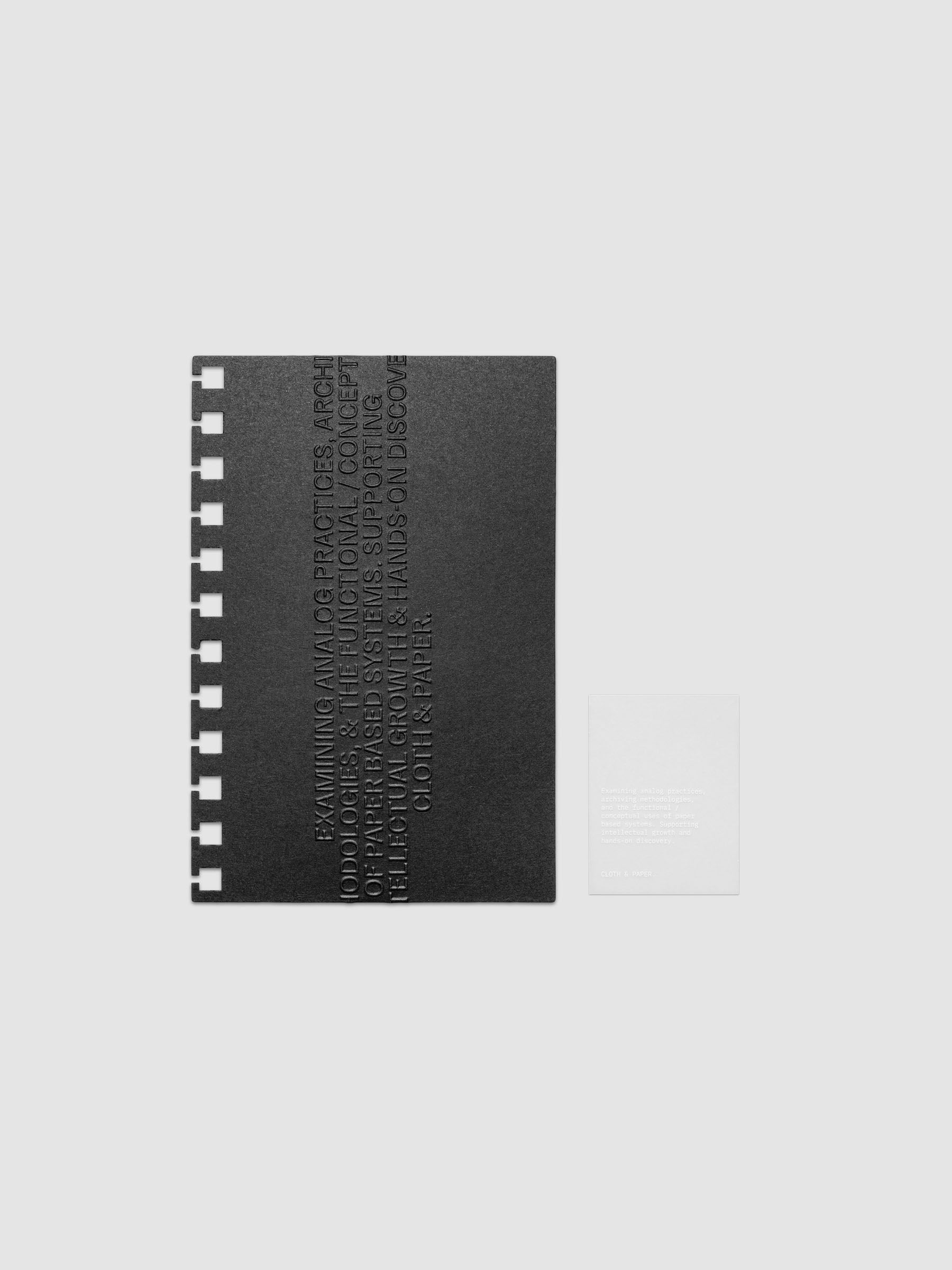 Black embossed Analog Embossed Planner Dashboard with drop card shown in size CP Petite Spiral.