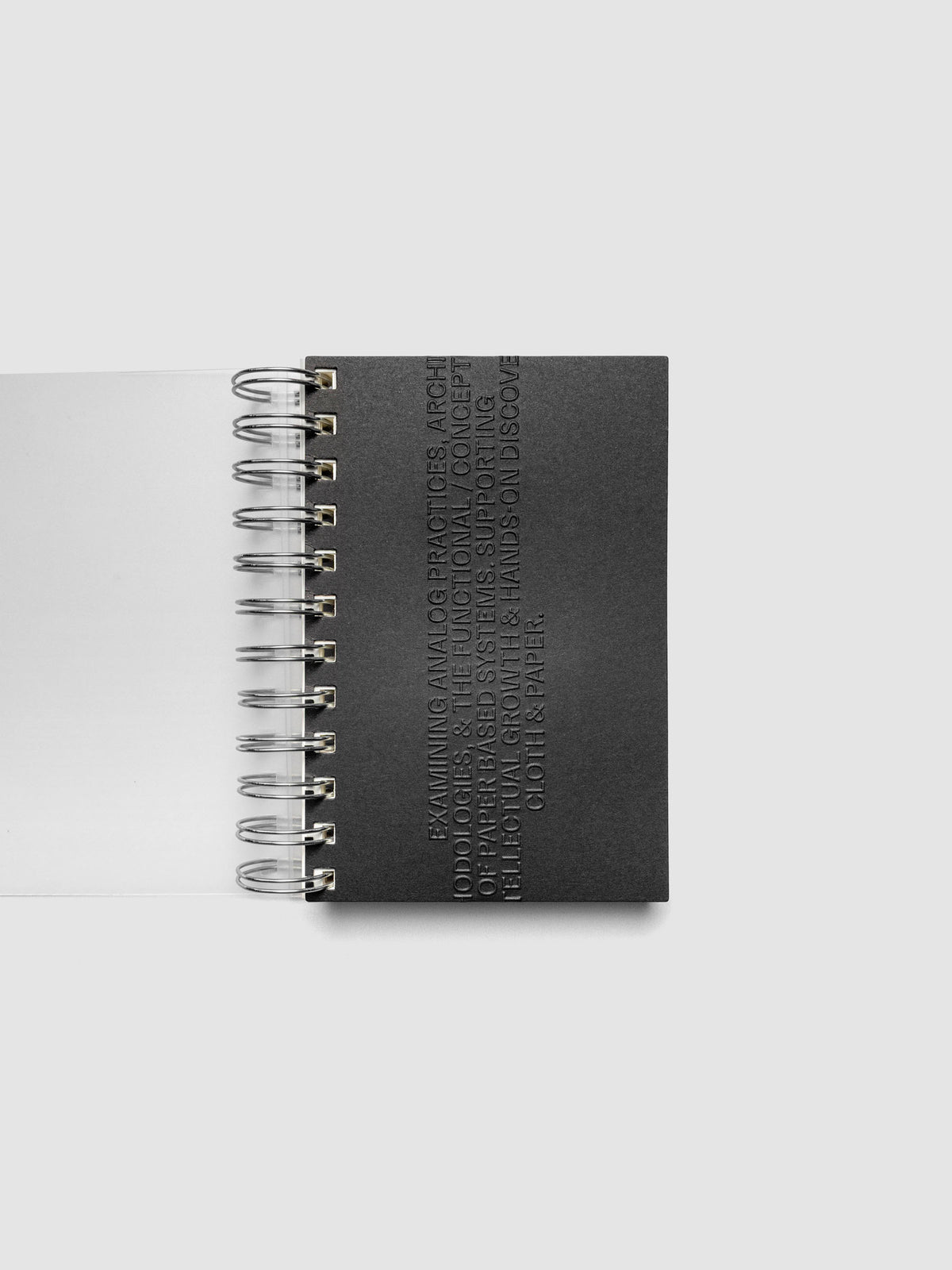 Black embossed Analog Embossed Planner Dashboard without the drop card shown in size CP Petite Spiral.