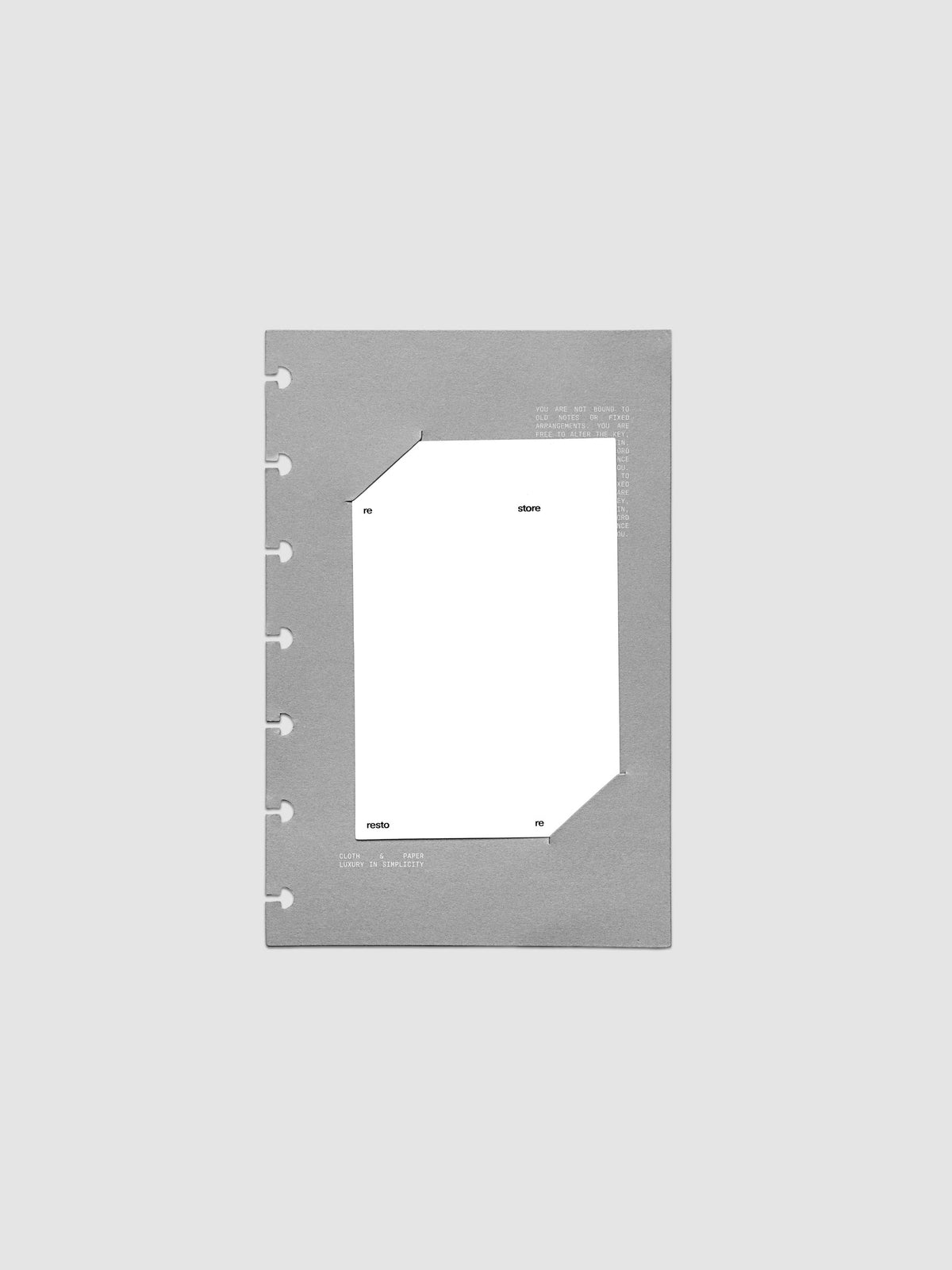 Grey cardstock planner dashboard with white plastic card inserted in slits with white printed text shown in size HP Mini for discbound planners.