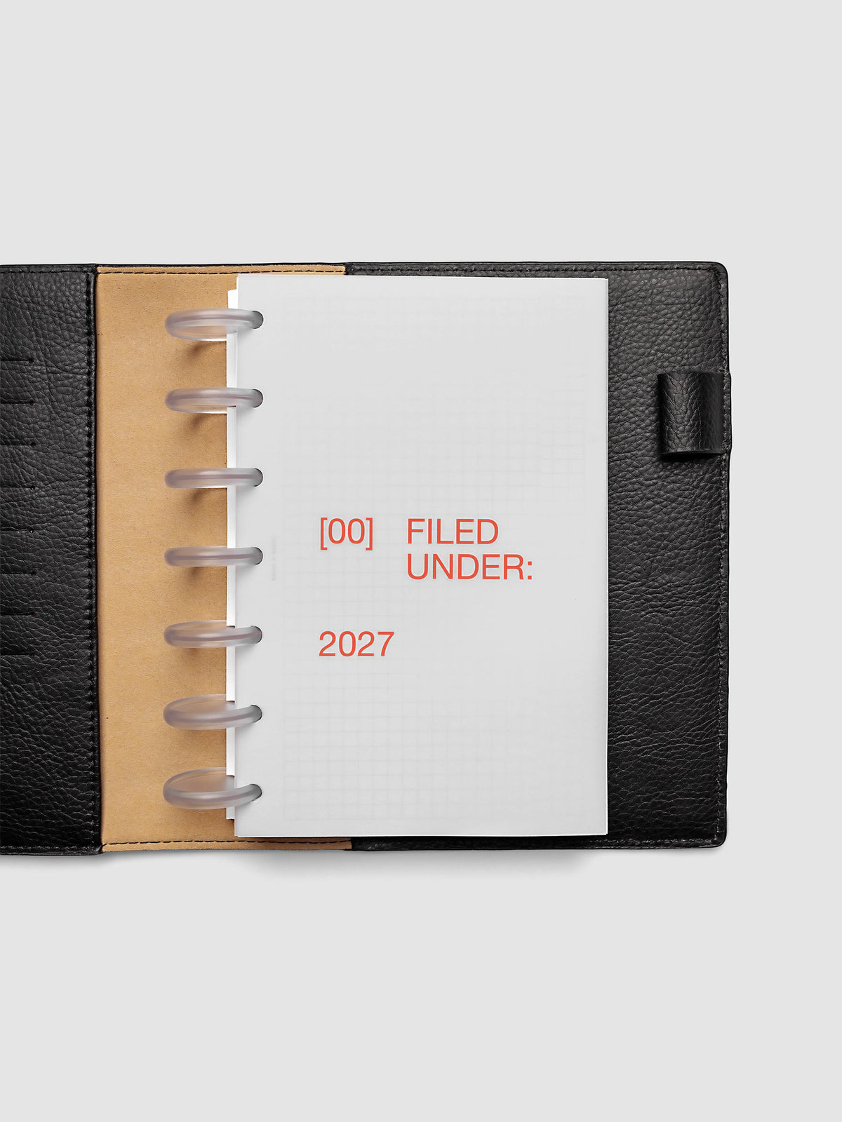 2027 Front + Monthly Dashboard Overlays, Saffron, HP Mini 7-Disc Punch, vellum dashboard overlay shown layered inside a planner