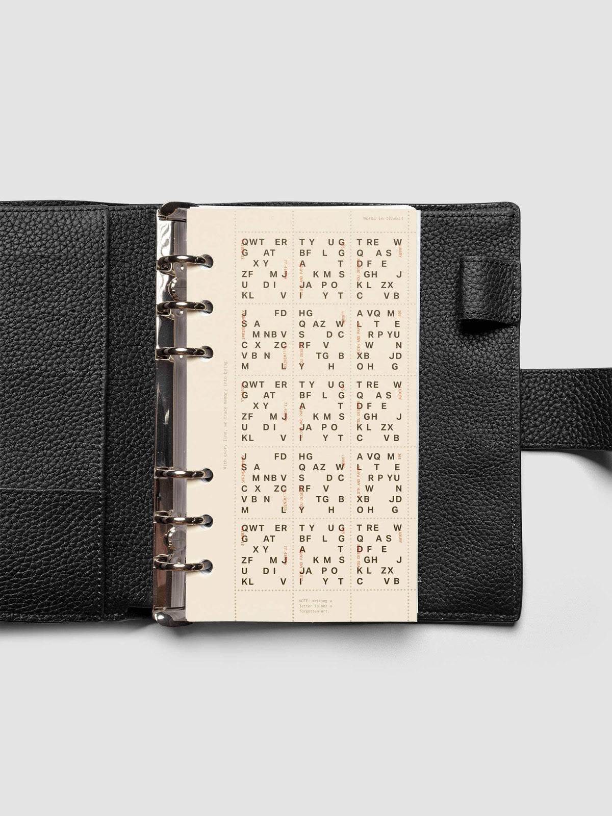 Stamp Sheet Planner Dashboard shown in a Personal black leather agenda.
