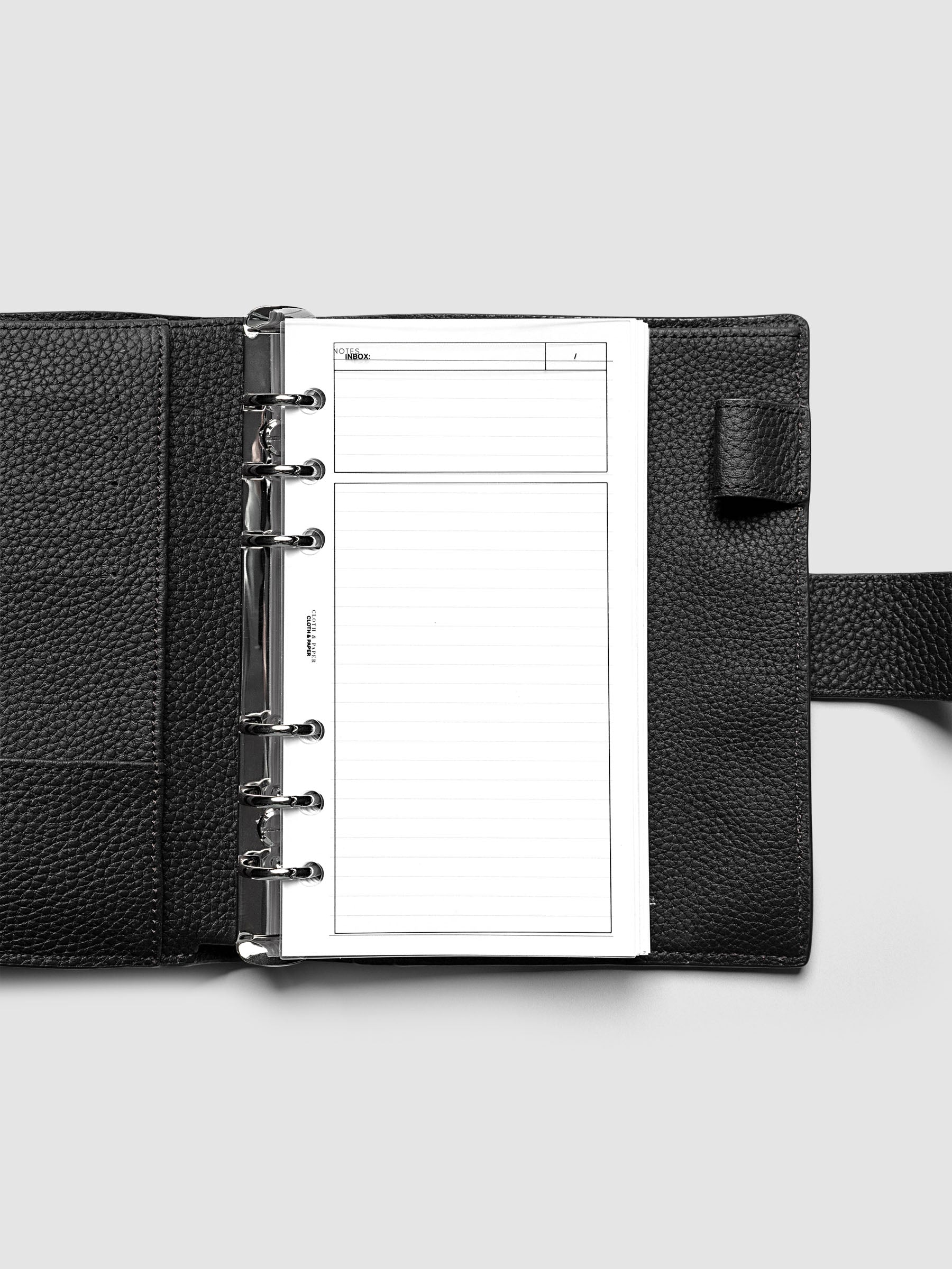 Clear, flexible plastic dashboard with black printed rectangular boxes and a header titled 'Inbox'. Shown in size Personal, pre-punched for 6-ring binders.