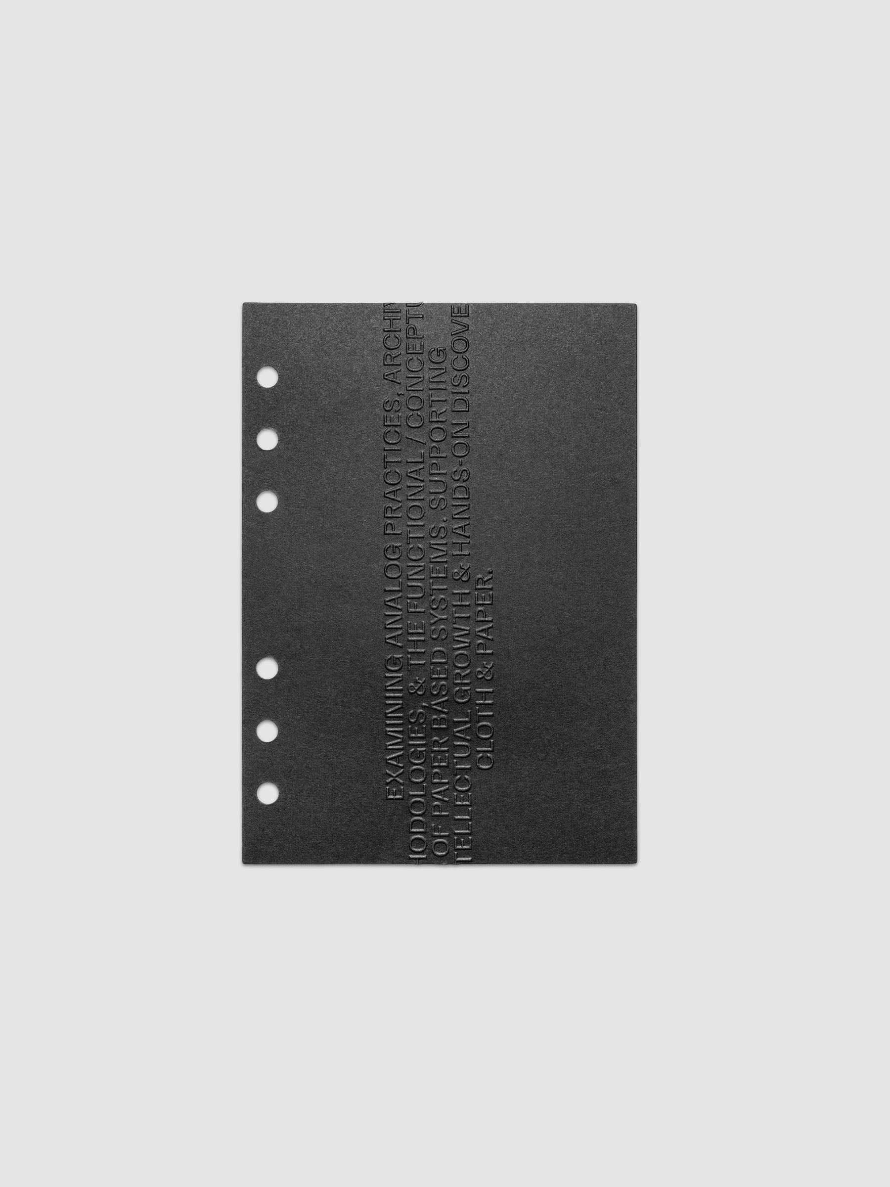 Black embossed Analog Embossed Planner Dashboard without the drop card shown in size Personal Wide.