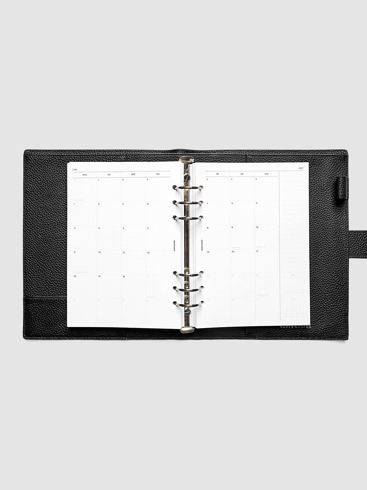 2027 Dated Monthly Planner Inserts, Monday Start, A5 6-Ring Punch, full two-page monthly calendar spread with Monday start, notes column, and mini calendars in the bottom right corner shown inside a planner
