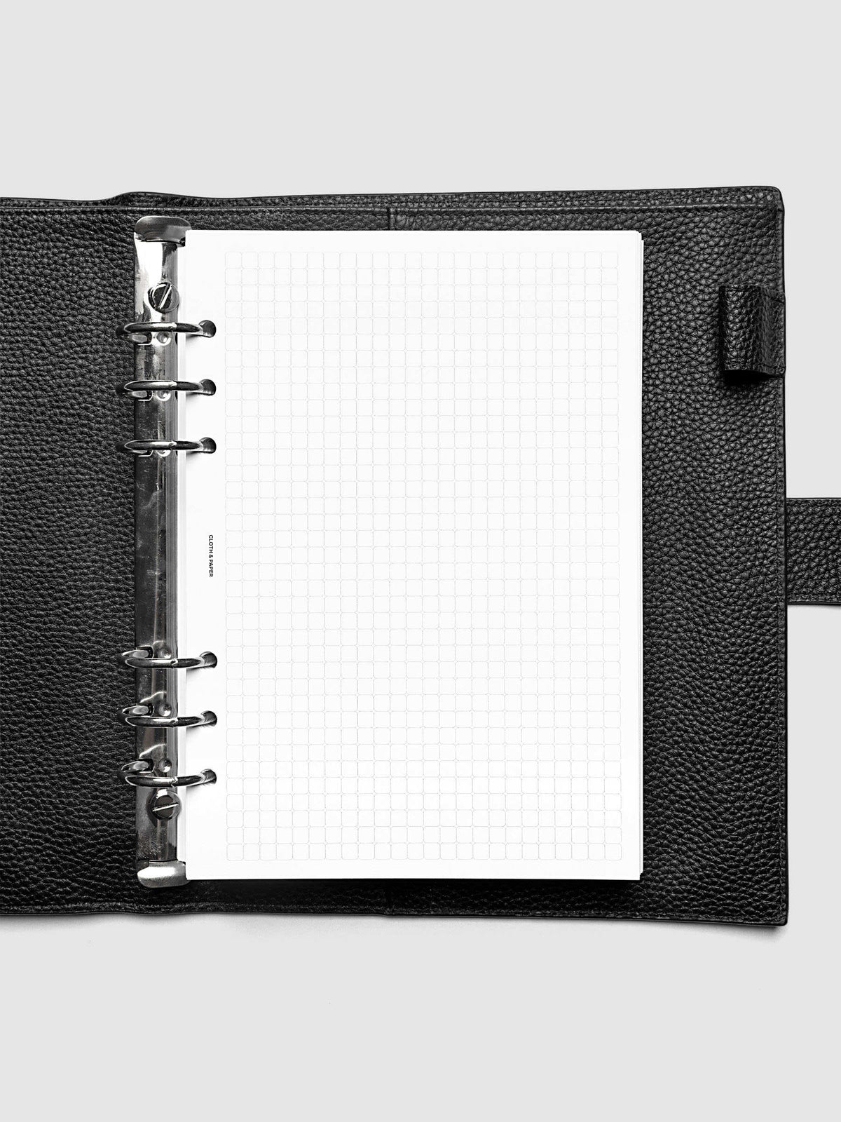 Rounded Graph Planner Insert A5 6-Ring Punch open to an unused grid page