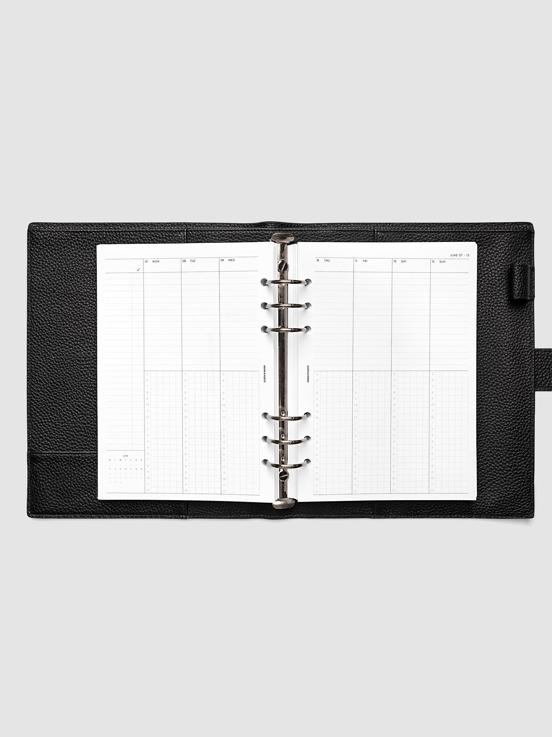 A5 6-Ring Punch weekly time block spread showing left and right pages in a planner
