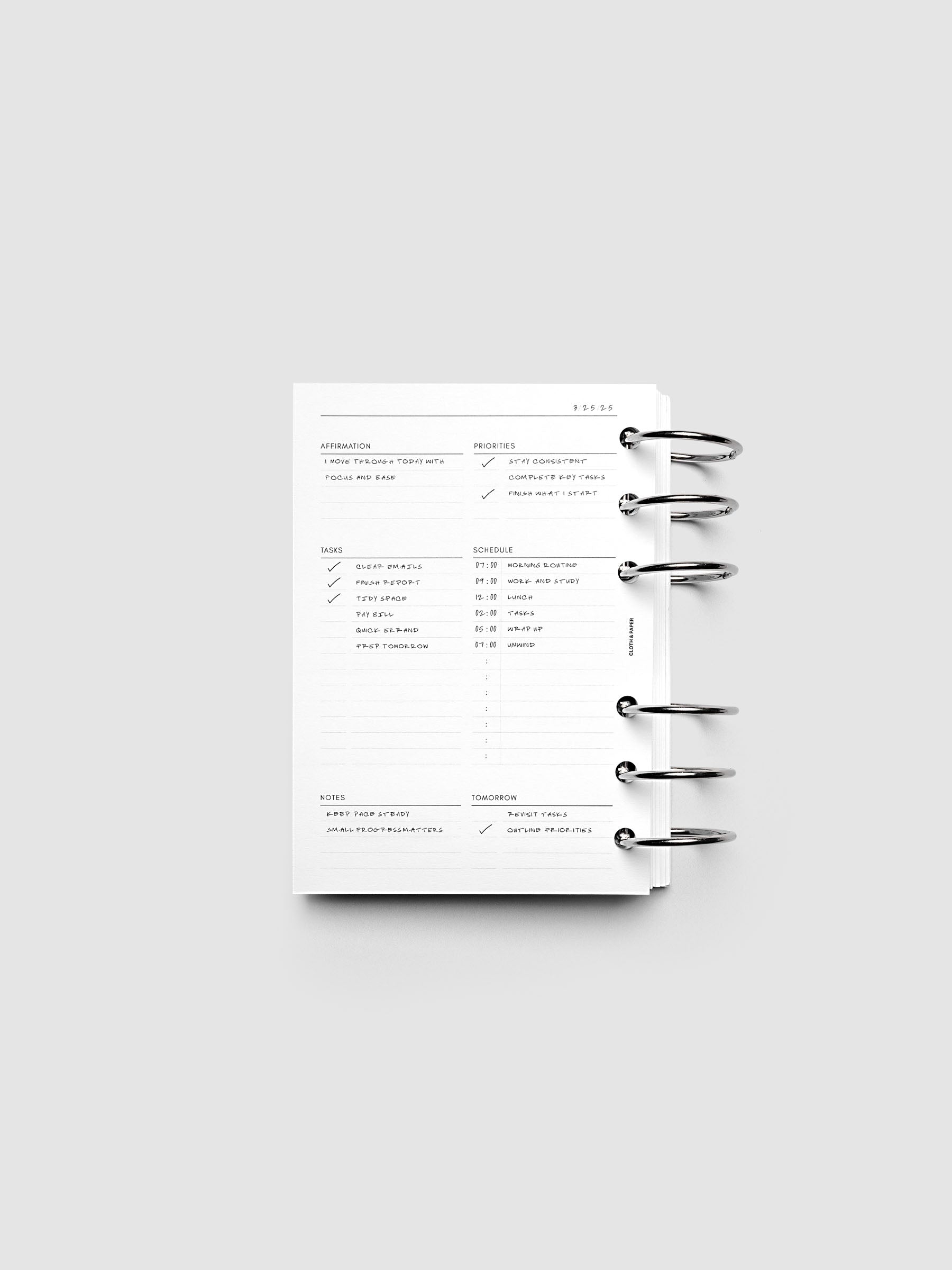 Demo page for the Daily Essentials Planner Inserts shown ring bound in size A6.