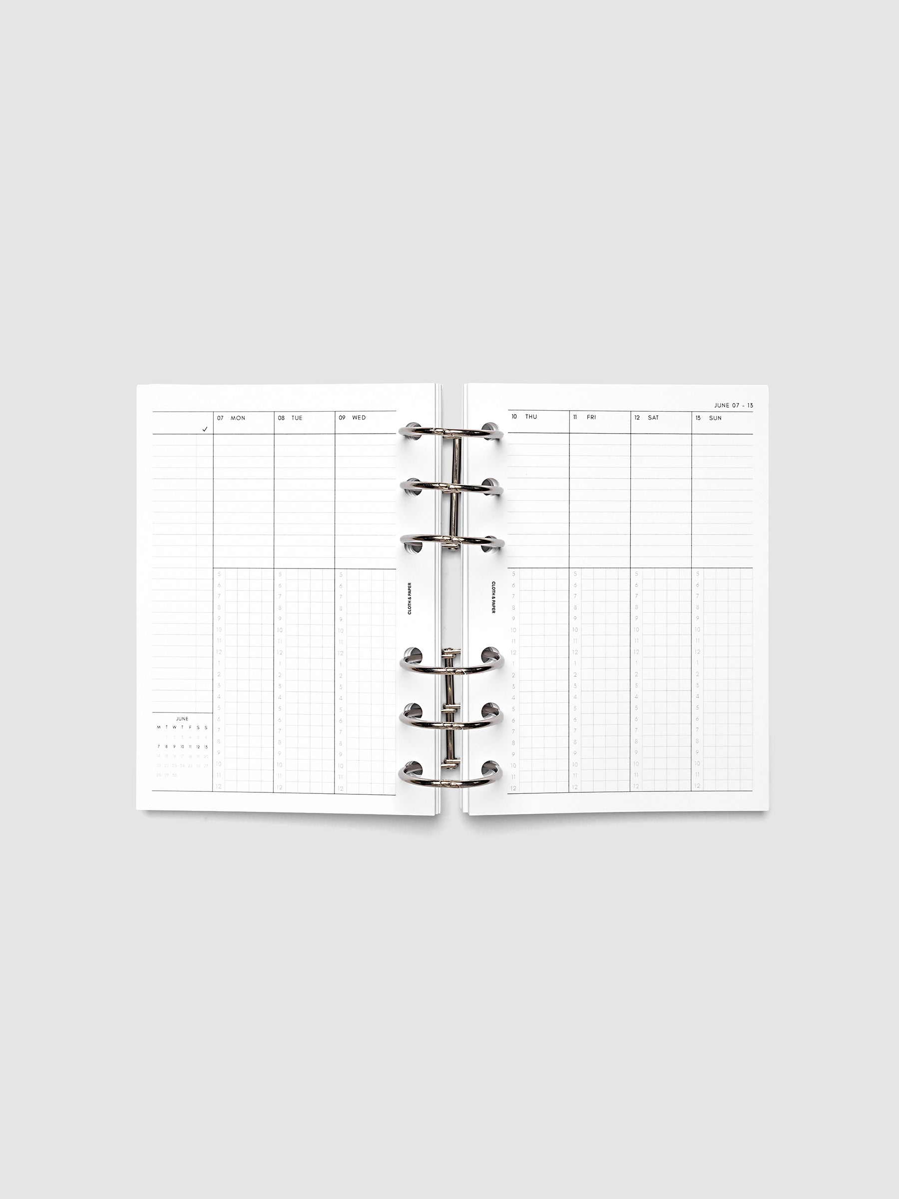 A6 6-Ring Punch weekly time block spread showing left and right pages in a planner