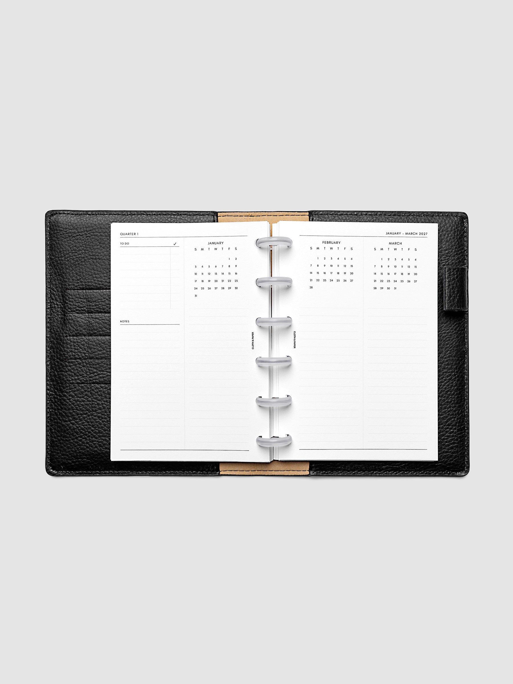 2027 Dated Yearly Overview Planner Inserts Sunday Start, CP Petite 6-Disc Punch, full quarterly spread showing goal-setting, to-do, and notes sections on the left page alongside three monthly calendar views with notes sections on the right page, shown inside a planner