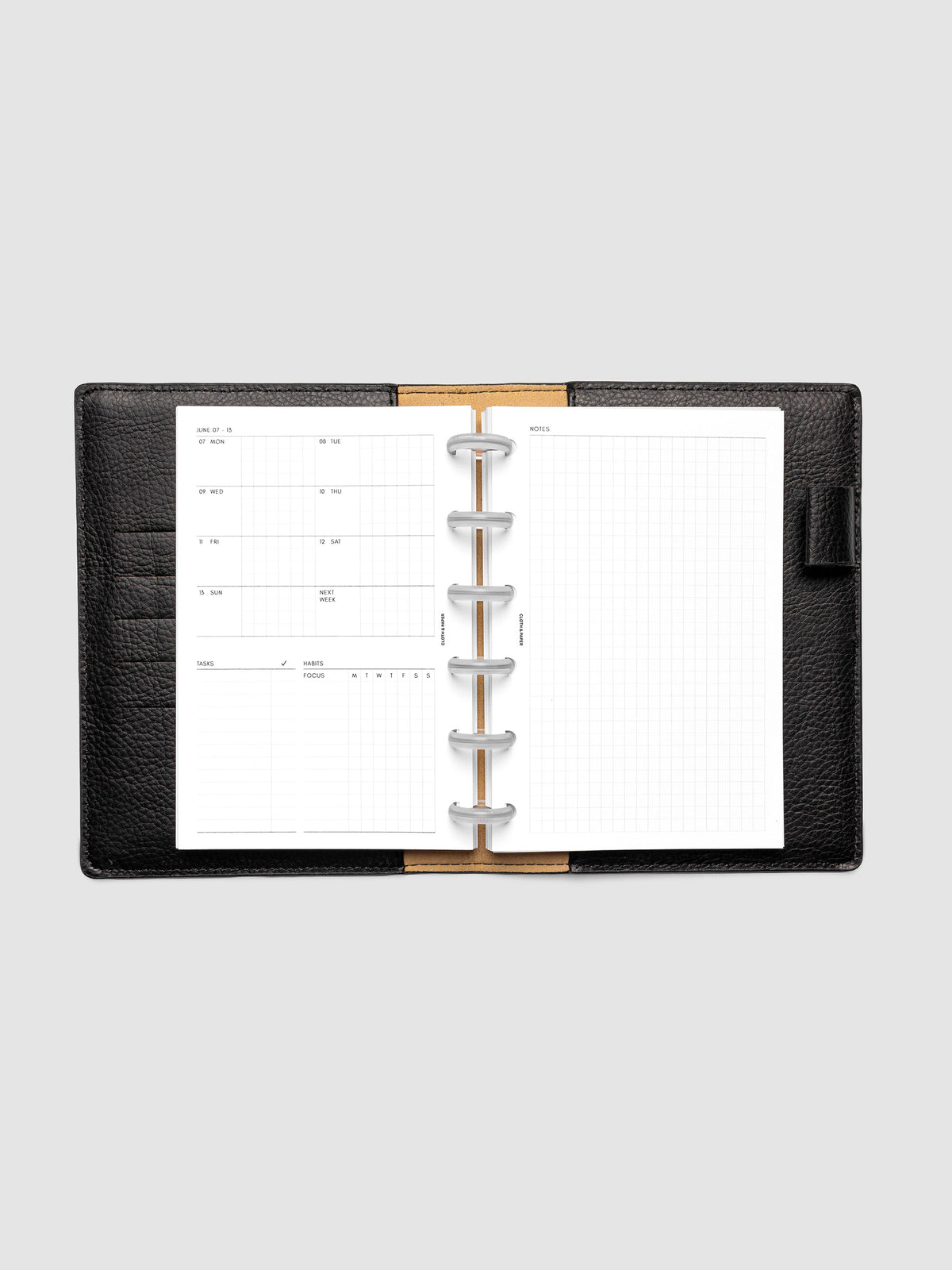 Open planner showing the full two-page 2027 Dated Weekly Admin spread in CP Petite 6-Disc Punch size, with the weekly overview and task and habit tracking sections on the left and a graph notes layout on the right