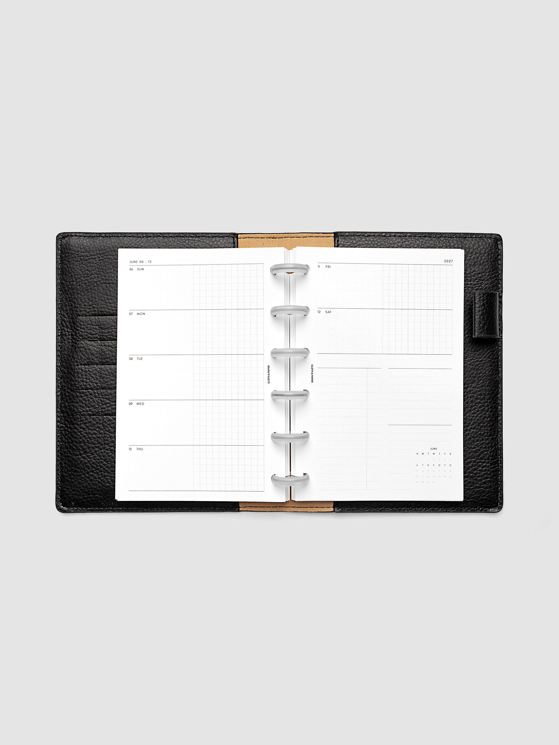 2027 Dated Weekly Horizontal Planner Inserts, Sunday Start, CP Petite 6-Disc Punch, full week-on-two-pages horizontal spread showing each day split into open and graph columns, with tasks column, notes column, and mini monthly calendar on the right page, shown inside a planner