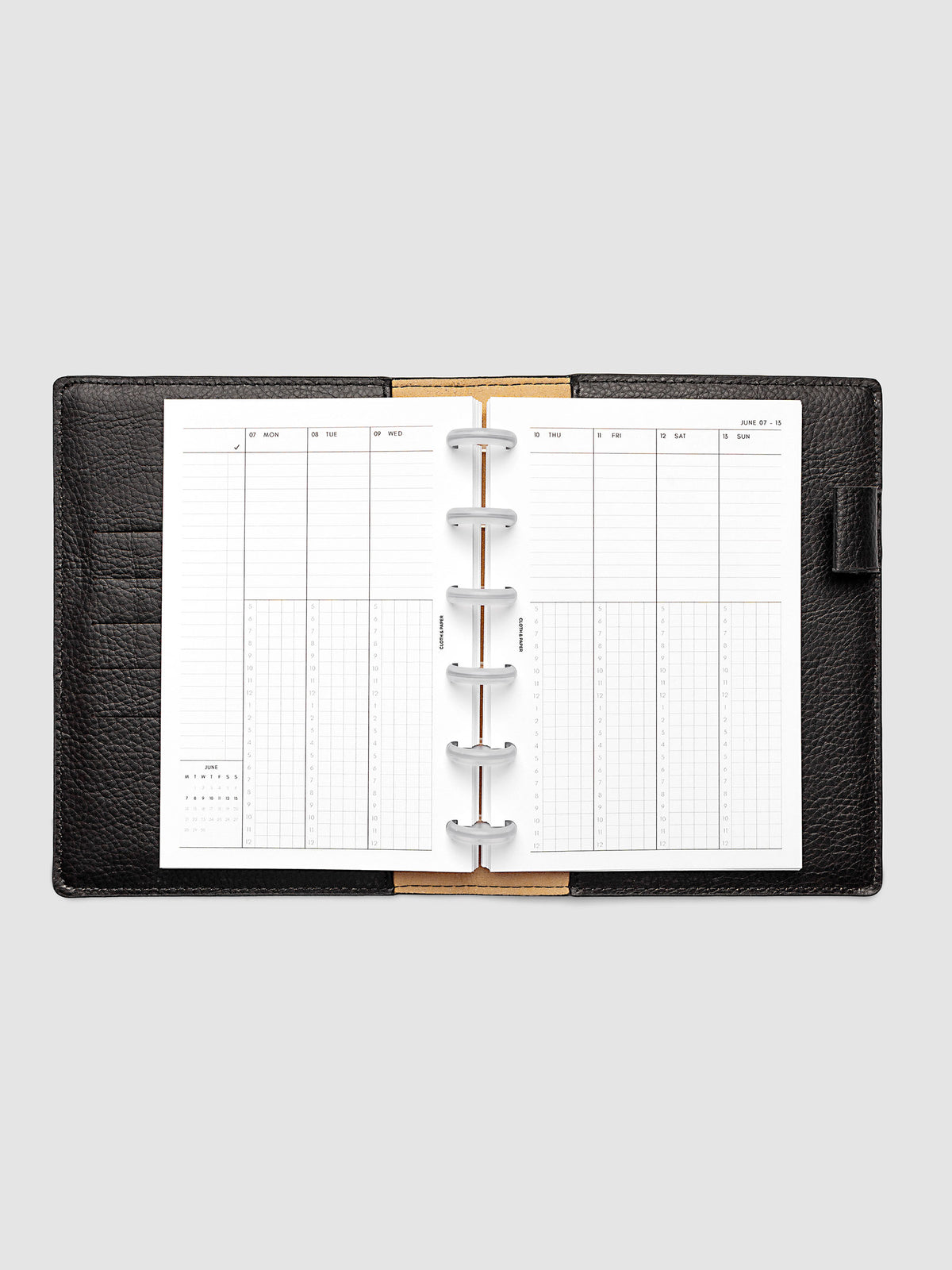 CP Petite 6-Disc Punch weekly time block spread showing left and right pages in a planner