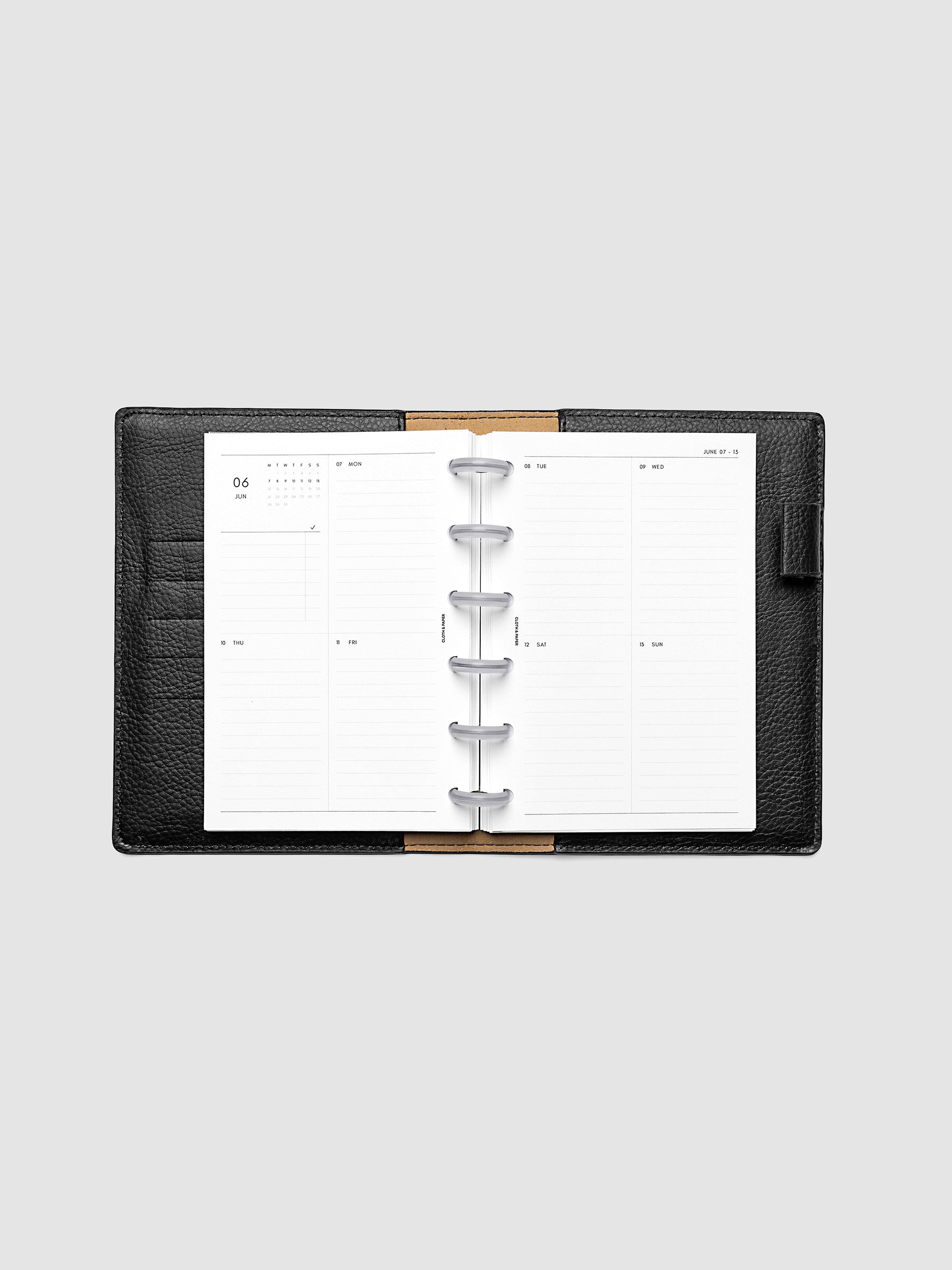 Both pages inside planner: 2027 Dated Weekly Vertical Planner Inserts, Monday Start, CP Petite 6-Disc Punch, full week-on-two-pages spread showing a two-column two-row daily grid with lined sections, mini monthly calendar and task list in the top left, shown inside a planner