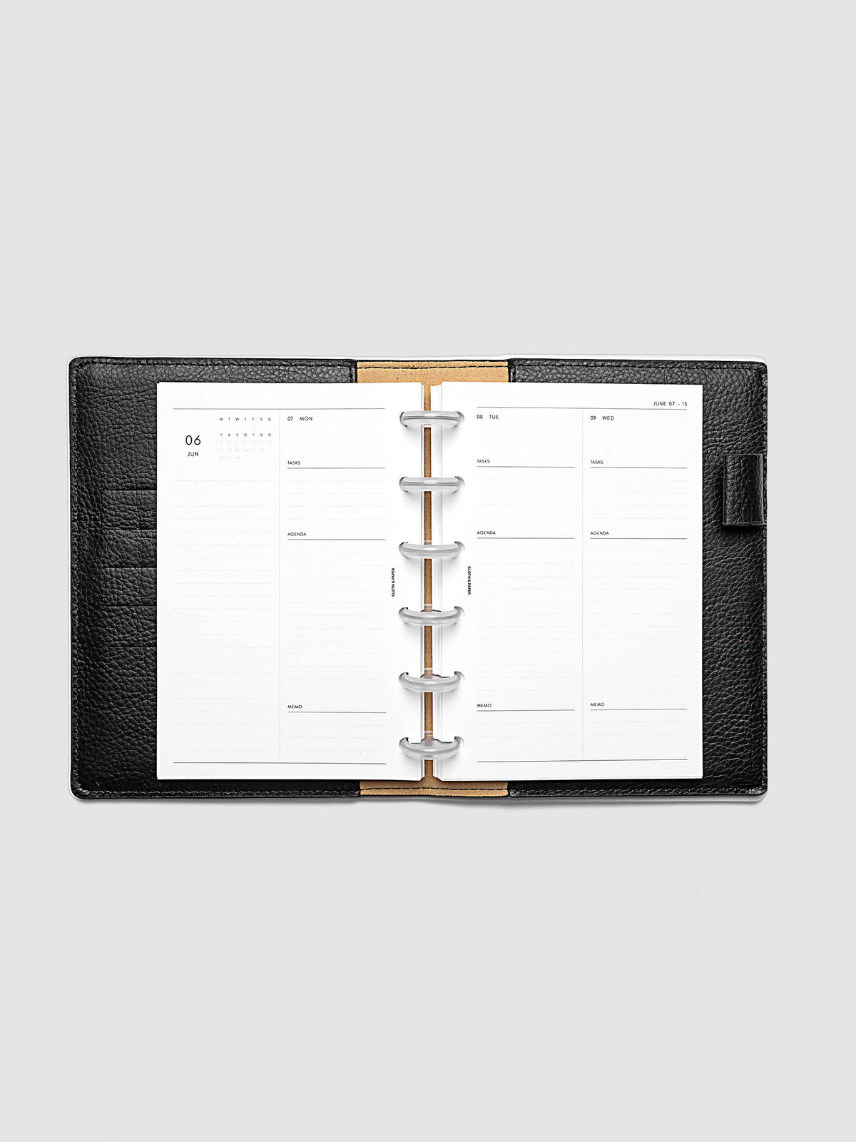 2027 Dated Daily Inserts | Monday Start in size CP Petite 6-Disc Punch inside a black planner cover