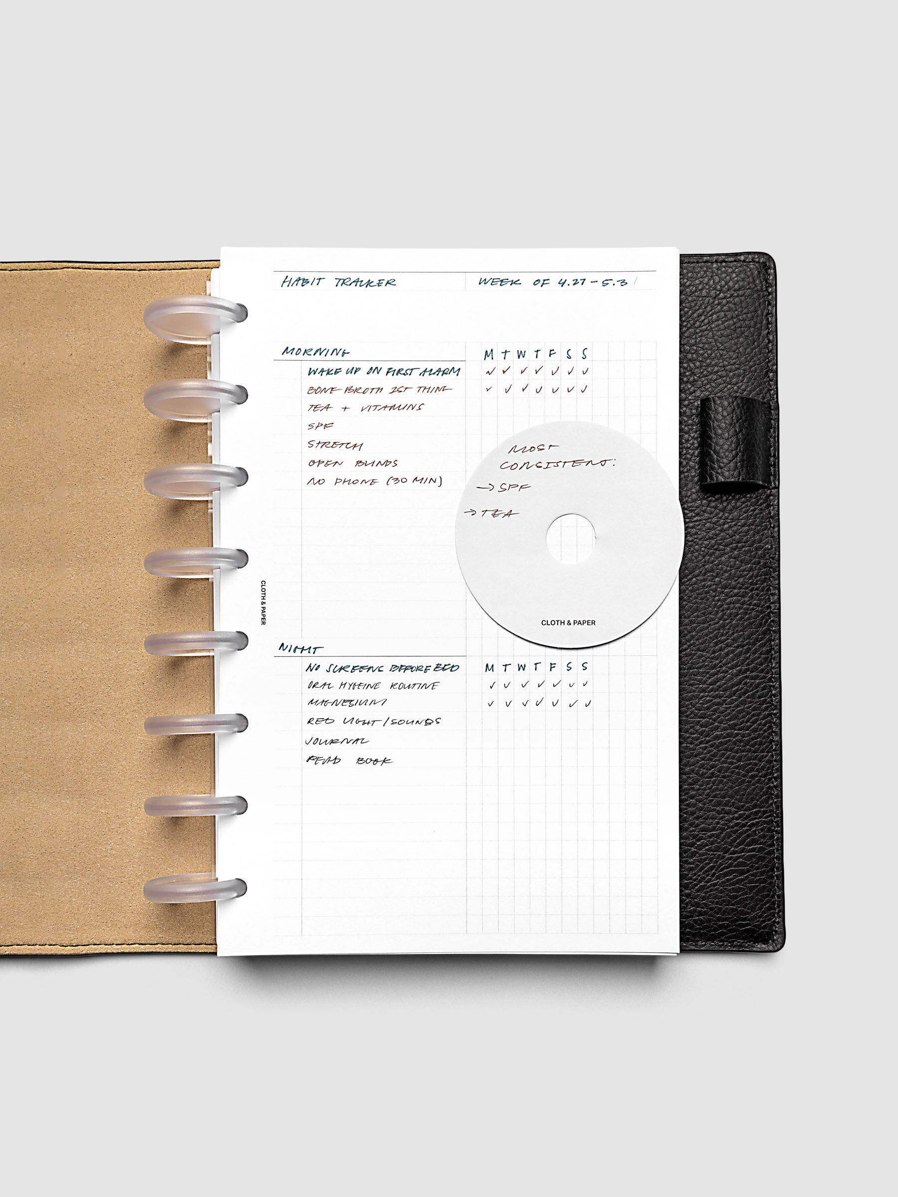 Daily Workflow Planner Inserts, Half Letter 8-Disc Punch, right page with handwritten notes filling the large graph section shown inside a planner