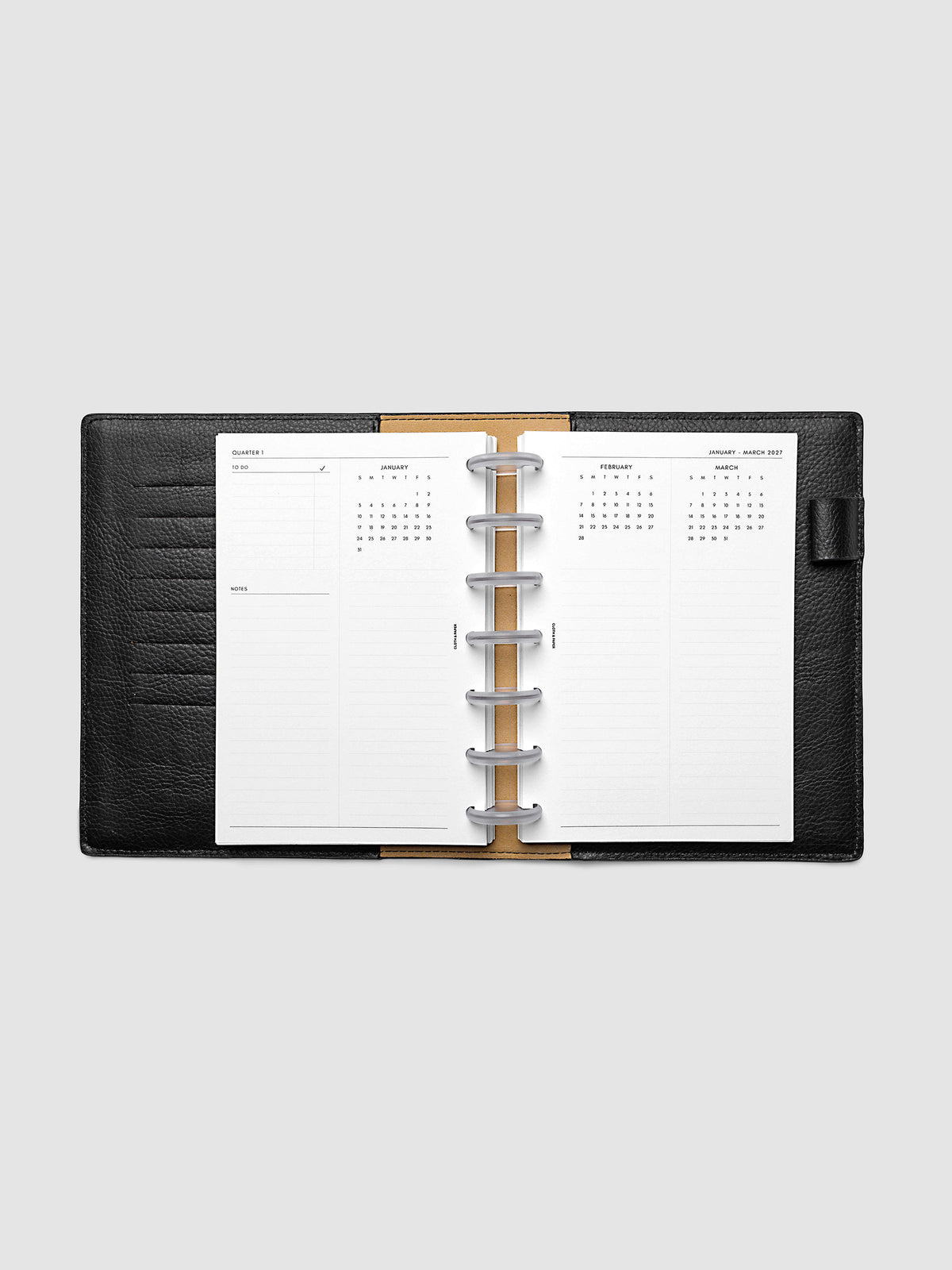 2027 Dated Yearly Overview Planner Inserts Sunday Start, HP Mini 7-Disc Punch, full quarterly spread showing goal-setting, to-do, and notes sections on the left page alongside three monthly calendar views with notes sections on the right page, shown inside a planner