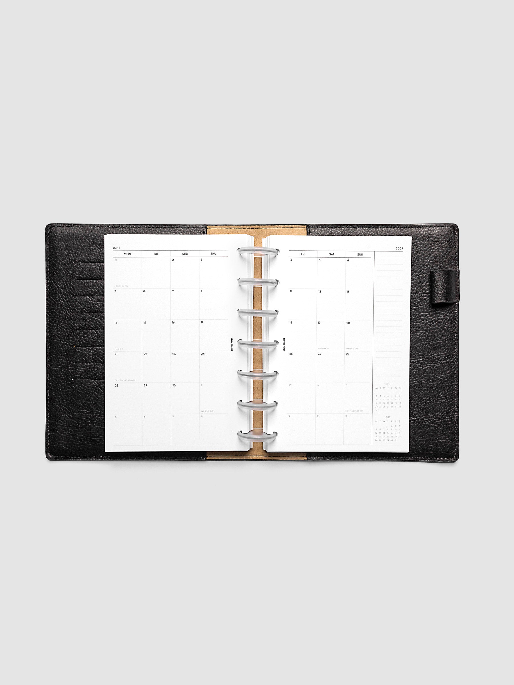 2027 Dated Monthly Planner Inserts, Monday Start, HP Mini 7-Disc Punch, full two-page monthly calendar spread with Monday start, notes column, and mini calendars in the bottom right corner shown inside a planner