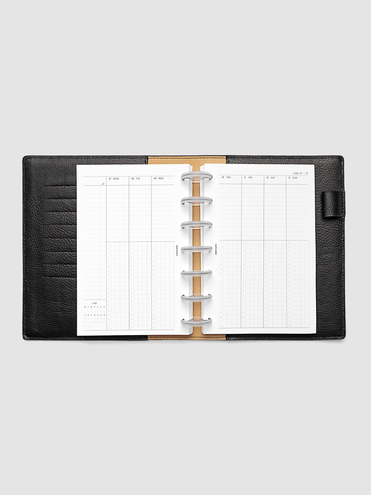 HP Mini 7-Disc Punch weekly time block spread showing left and right pages in a planner