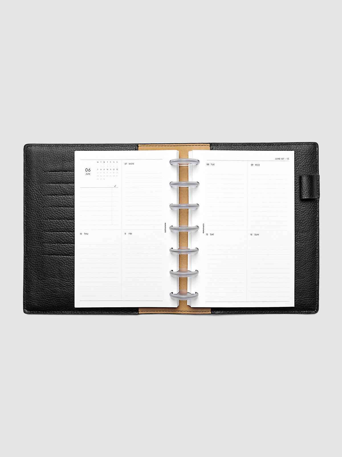 Both pages inside planner: 2027 Dated Weekly Vertical Planner Inserts, Monday Start, HP Mini 7-Disc Punch, full week-on-two-pages spread showing a two-column two-row daily grid with lined sections, mini monthly calendar and task list in the top left, shown inside a planner