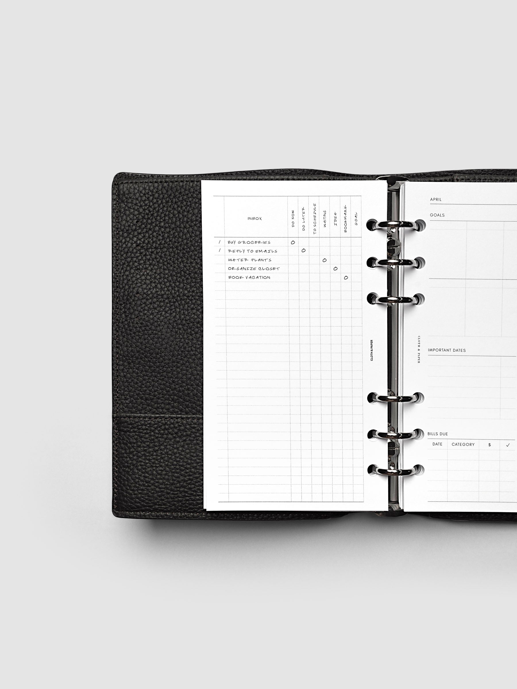 Demo page for Inbox Sorting Planner Inserts shown pre-punched for 6-Ring Personal planners in a black agenda.