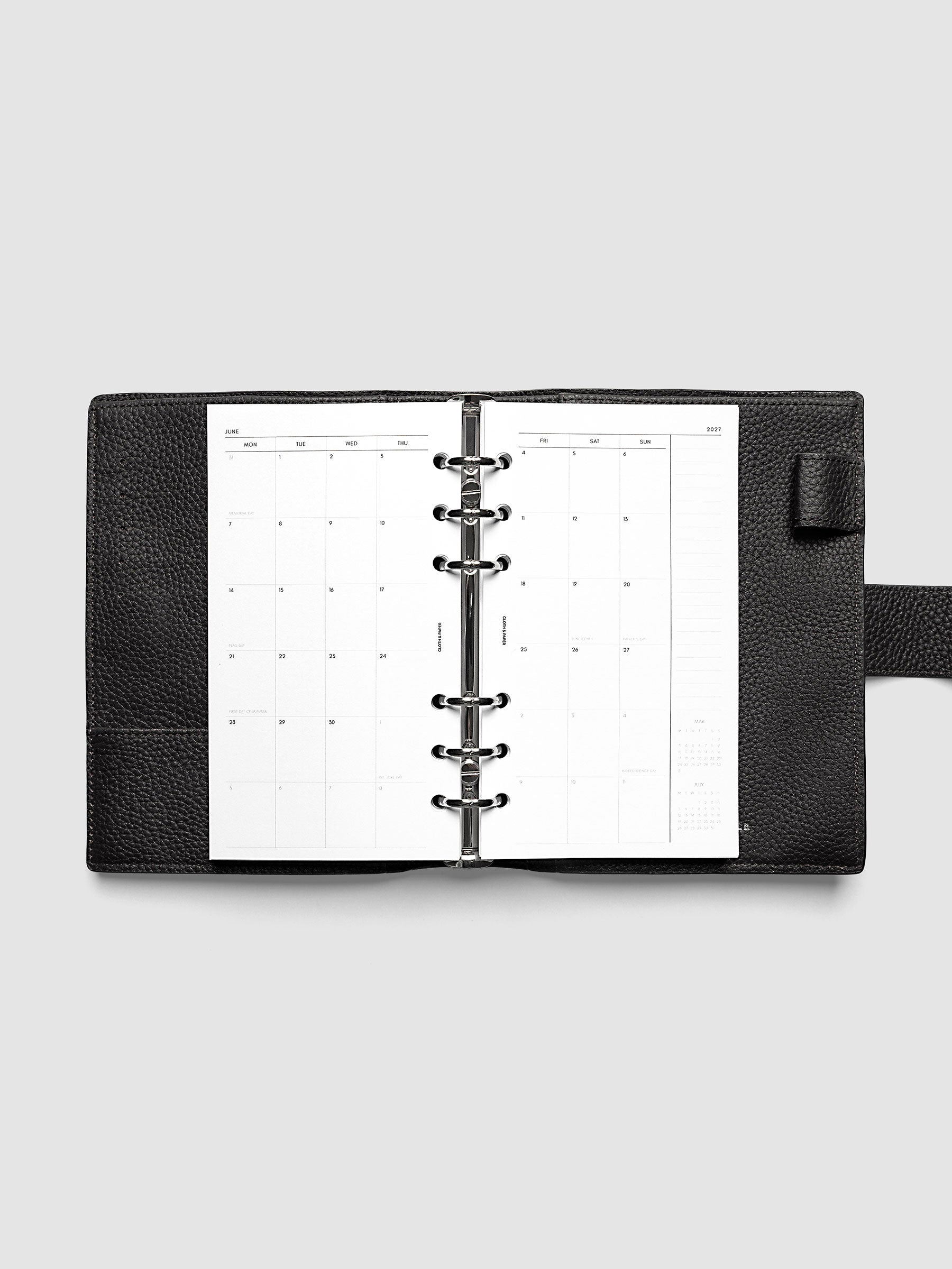 2027 Dated Monthly Planner Inserts, Monday Start, Personal 6-Ring Punch, full two-page monthly calendar spread with Monday start, notes column, and mini calendars in the bottom right corner shown inside a planner