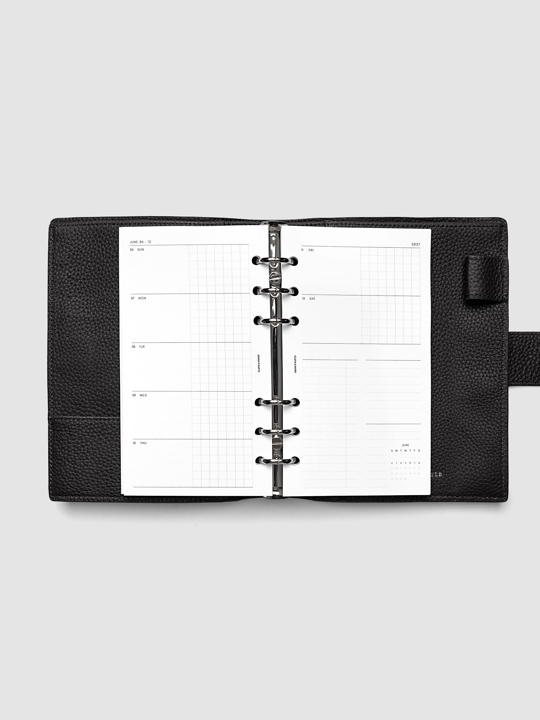 2027 Dated Weekly Horizontal Planner Inserts, Sunday Start, Personal 6-Ring Punch, full week-on-two-pages horizontal spread showing each day split into open and graph columns, with tasks column, notes column, and mini monthly calendar on the right page, shown inside a planner