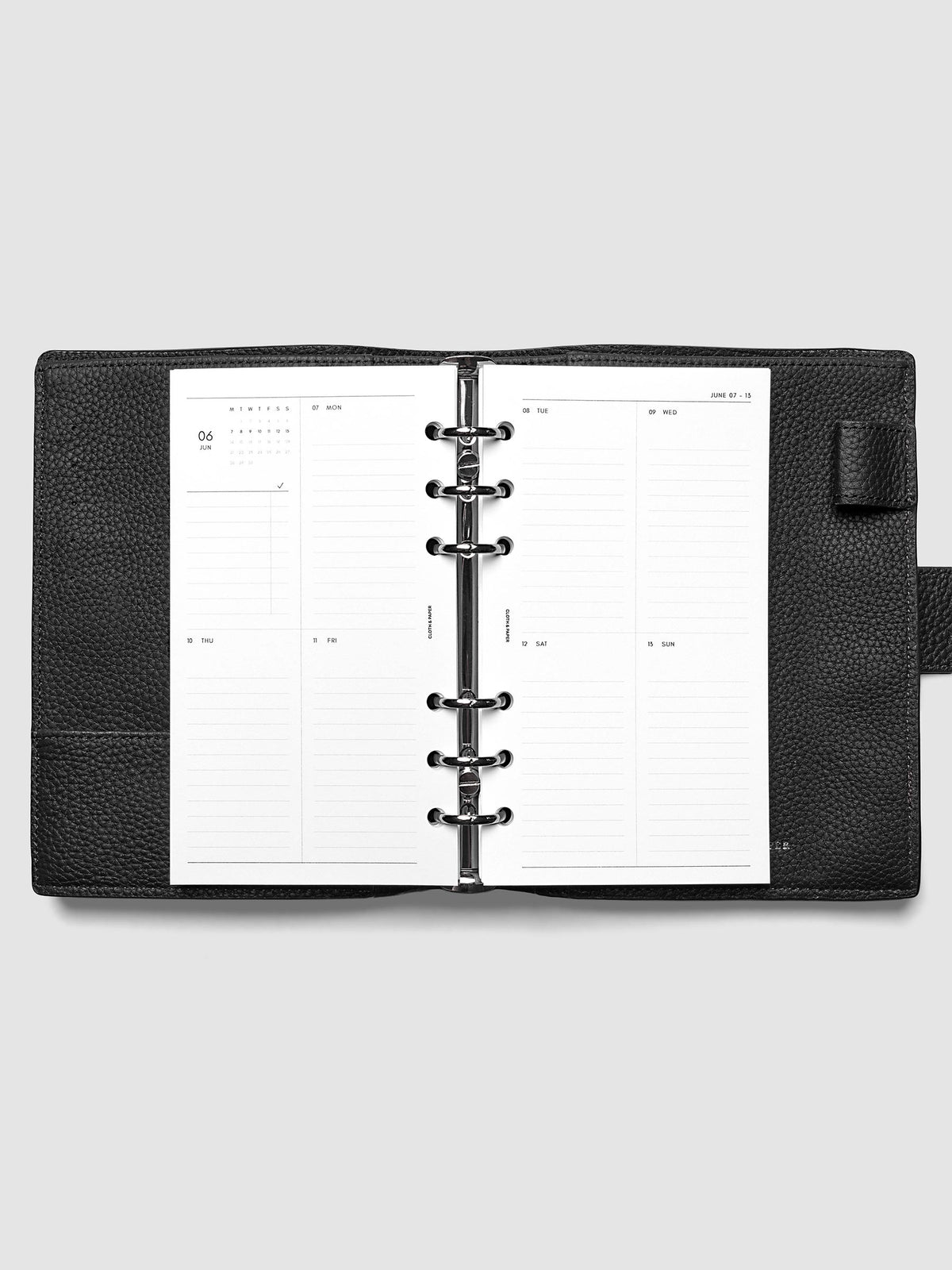 Both pages inside planner: 2027 Dated Weekly Vertical Planner Inserts, Monday Start, Personal 6-Ring Punch, full week-on-two-pages spread showing a two-column two-row daily grid with lined sections, mini monthly calendar and task list in the top left, shown inside a planner