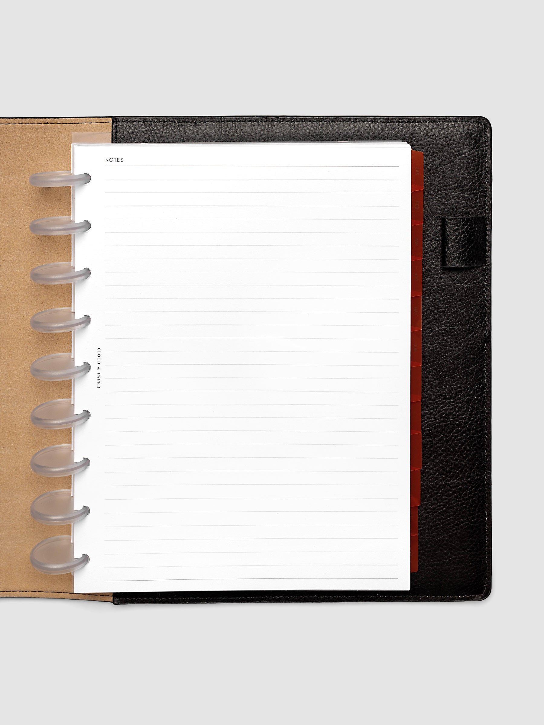 HP Classic 9-Disc Punch Ultra-Thin Monthly Dividers in deep orange shown tabbed inside a planner