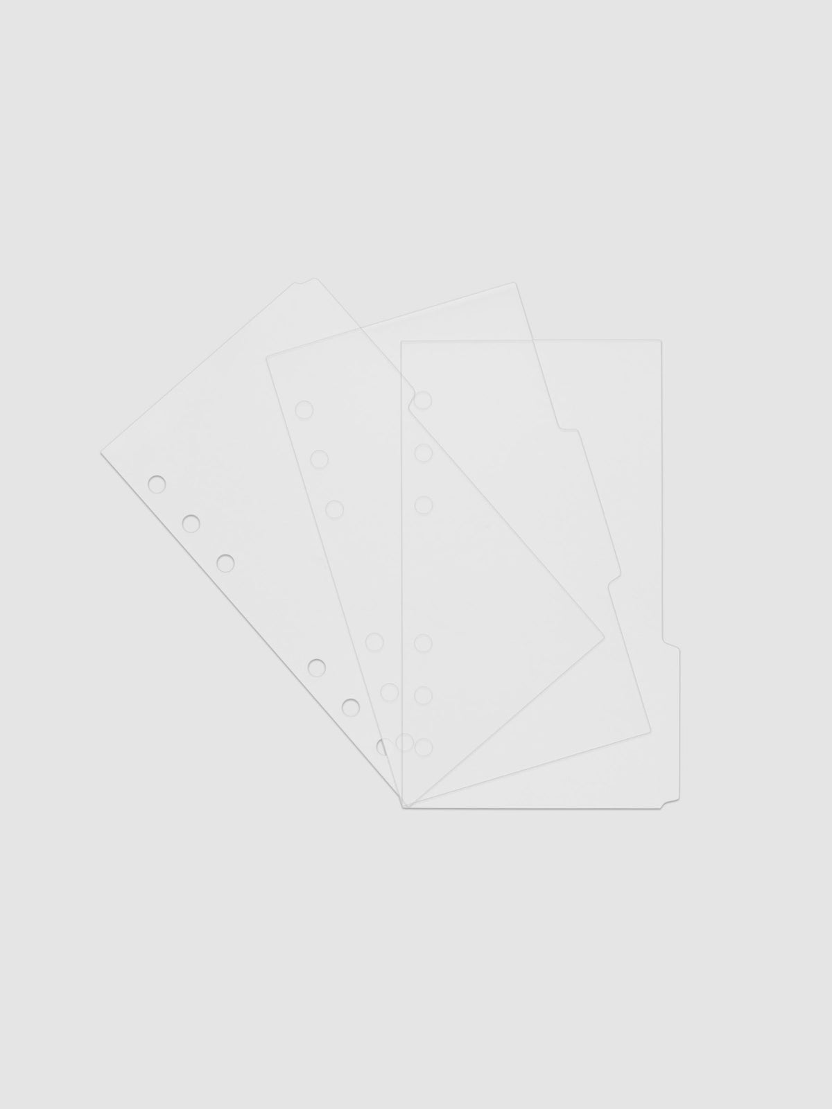 Three 6-ring punch clear side tab dividers sized for Personal planners.