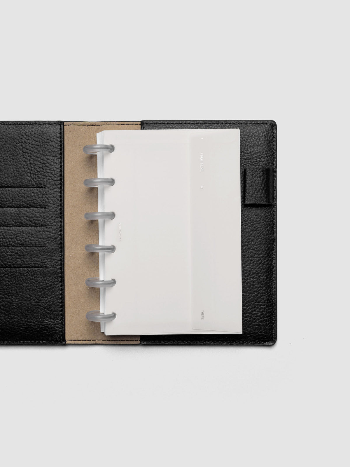 White Envelope Storage Holder shown inside a black, leather CP Petite folio.