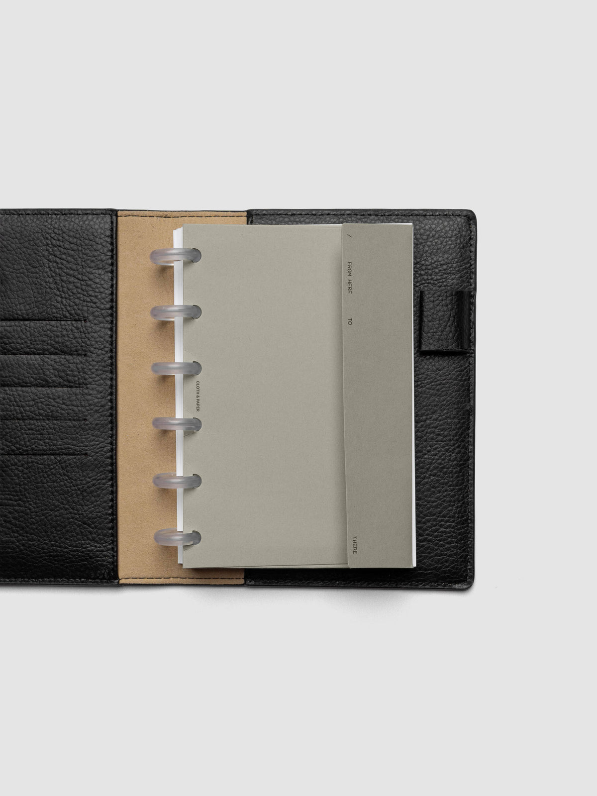 Beige Envelope Storage Holder shown inside a black, leather CP Petite folio.