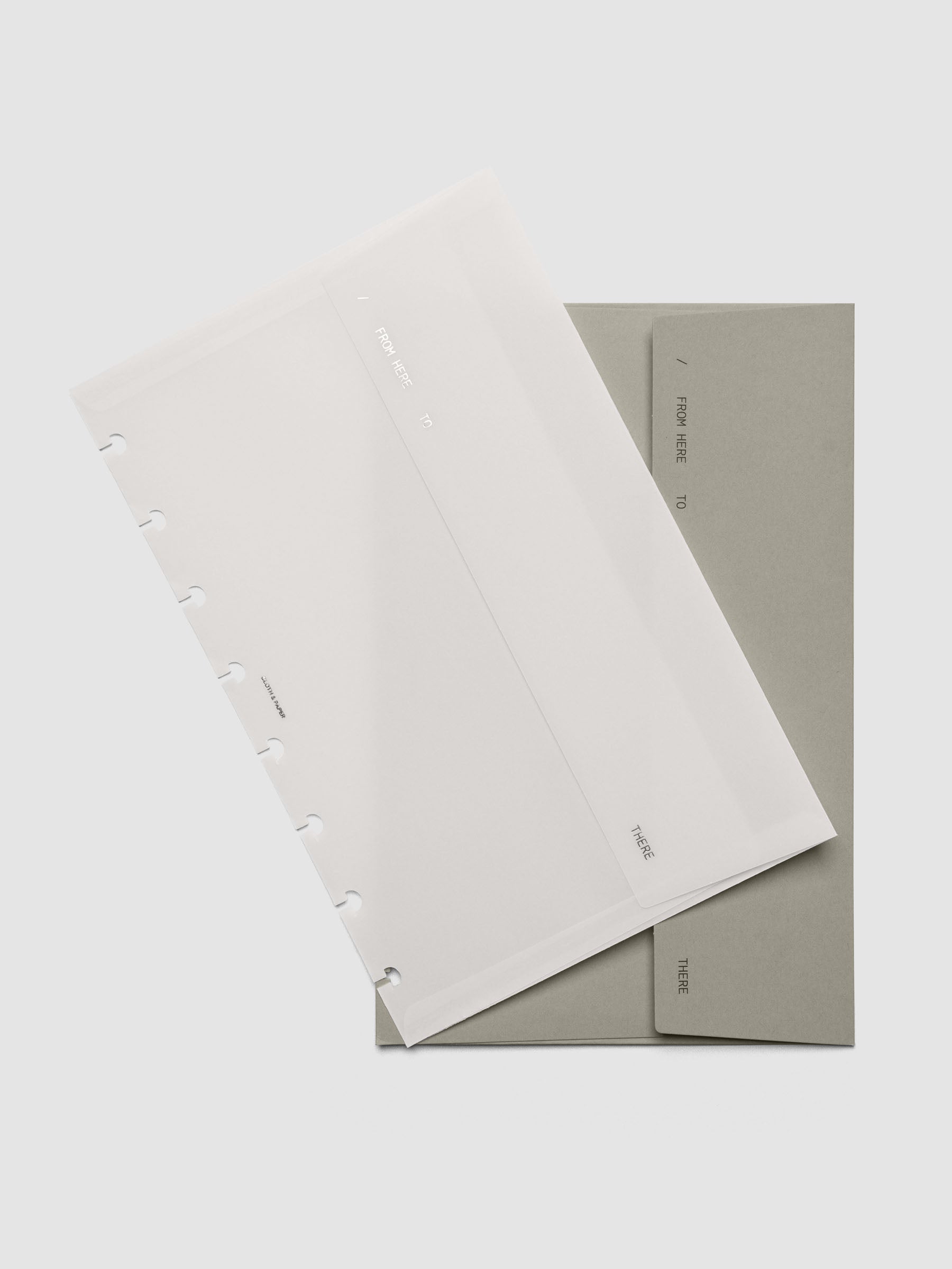 Envelope Storage Holder Set shown pre-punched for Half Letter discbound planners.