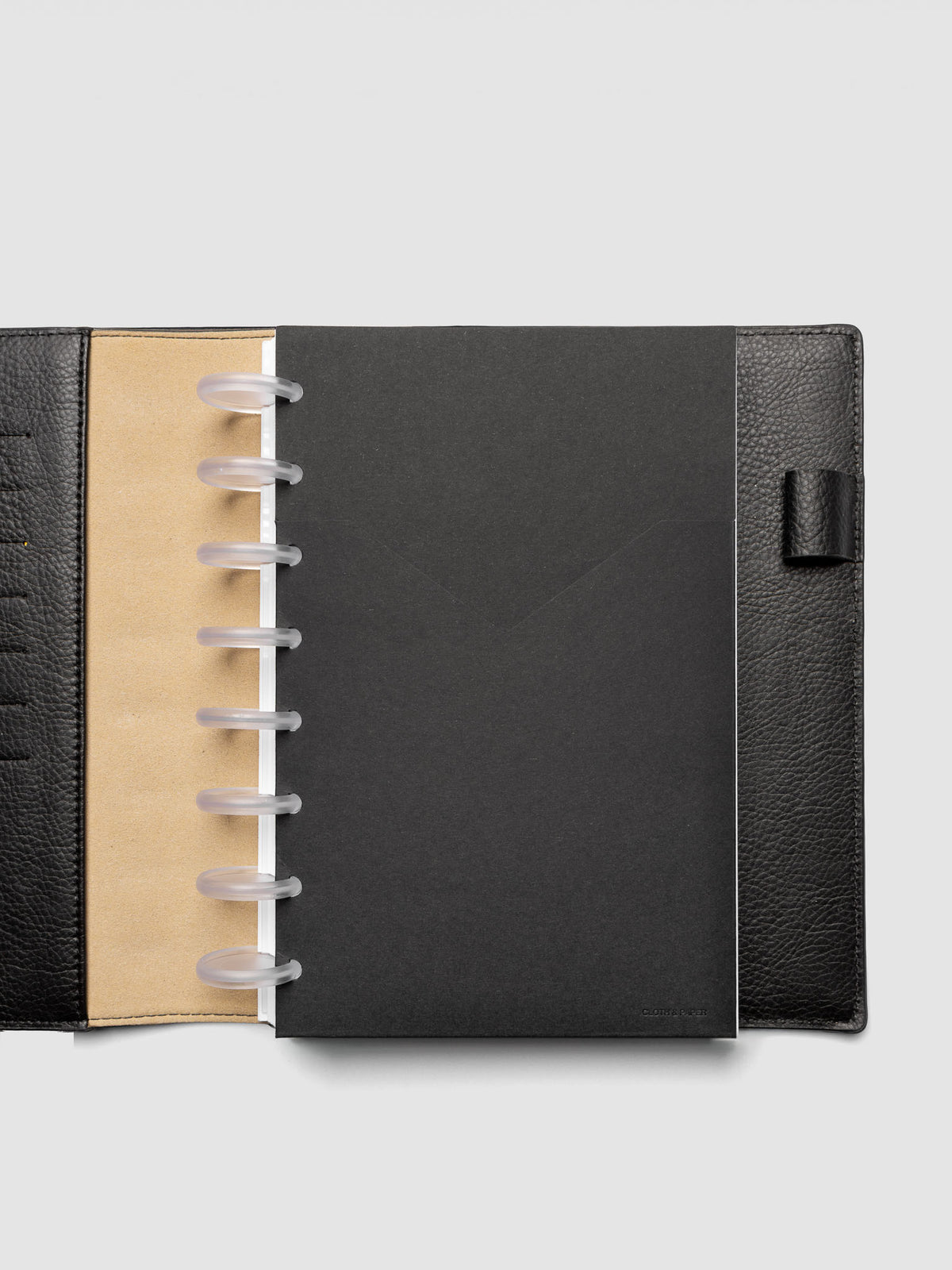 Black planner paper pocket folder shown inside a planner in size Half Letter 8-Disc Punch