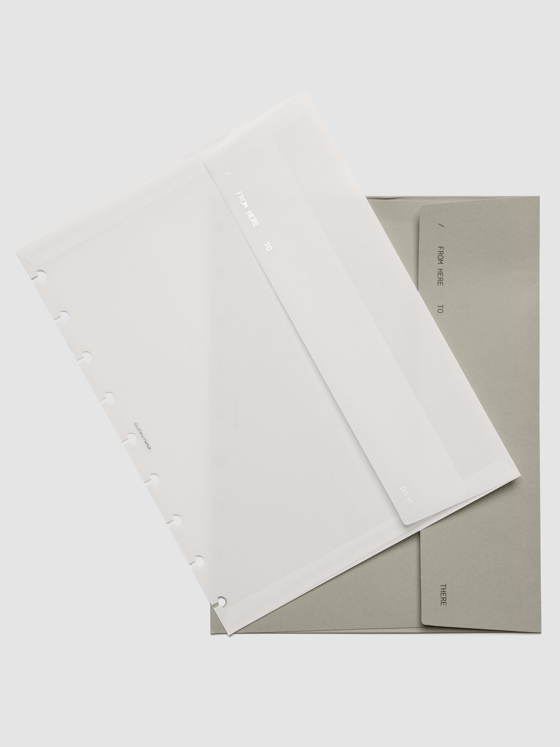 Envelope Storage Holder Set shown pre-punched for HP Classic discbound planners.