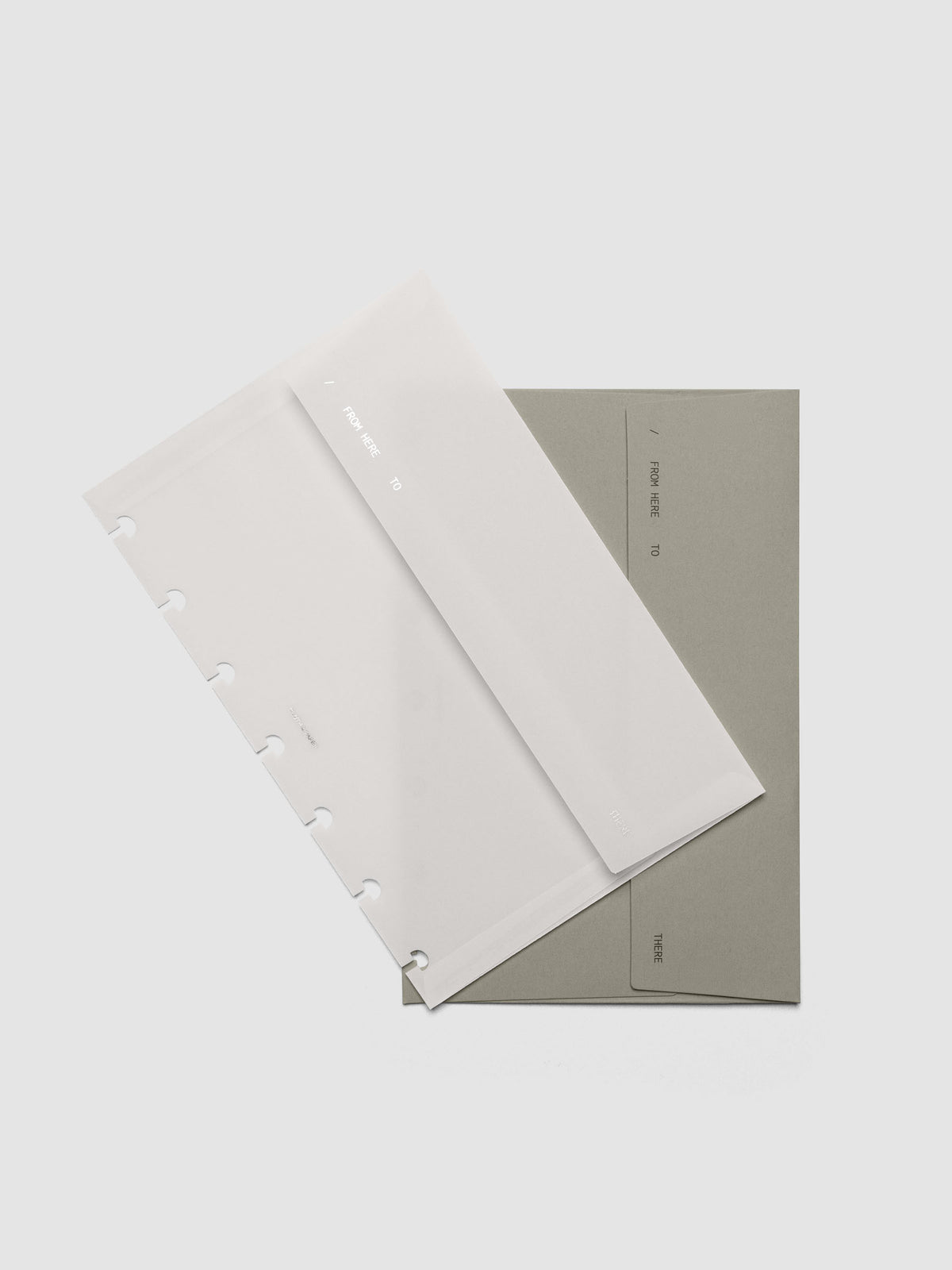 Envelope Storage Holder Set shown pre-punched for HP Mini discbound planners.