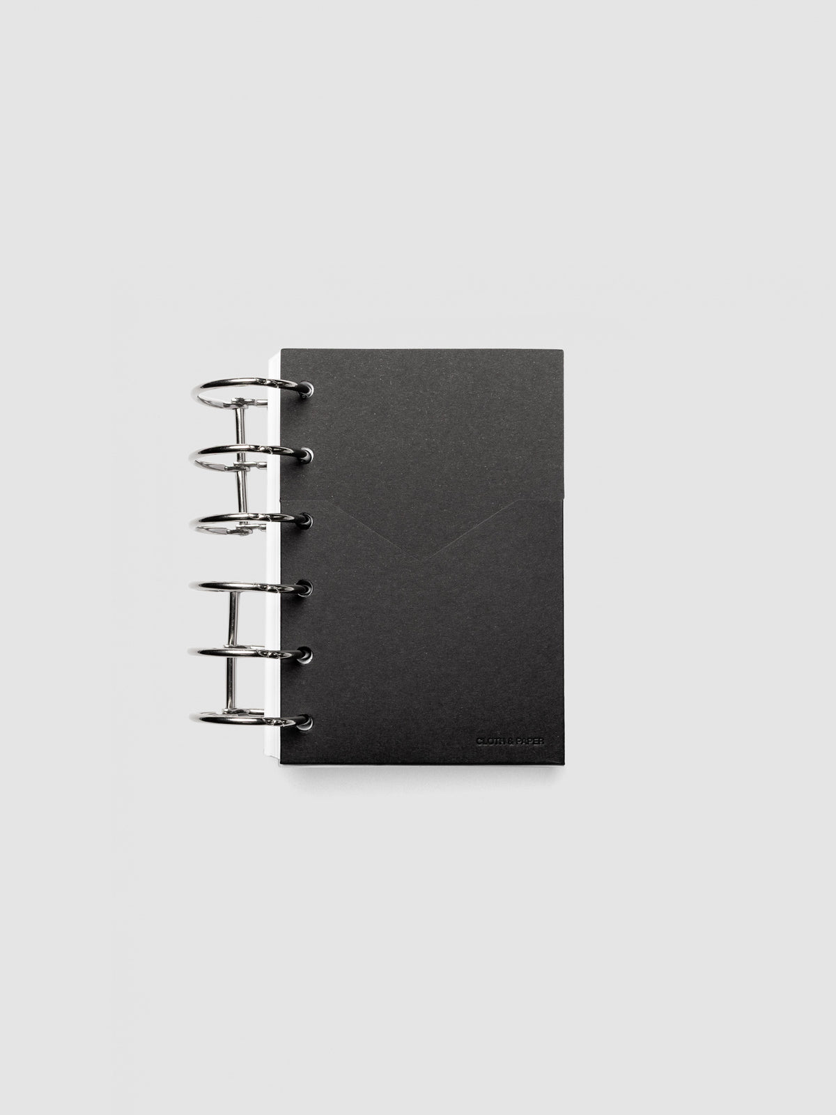Black planner paper pocket folder shown inside a planner in size Pocket 6-Ring Punch