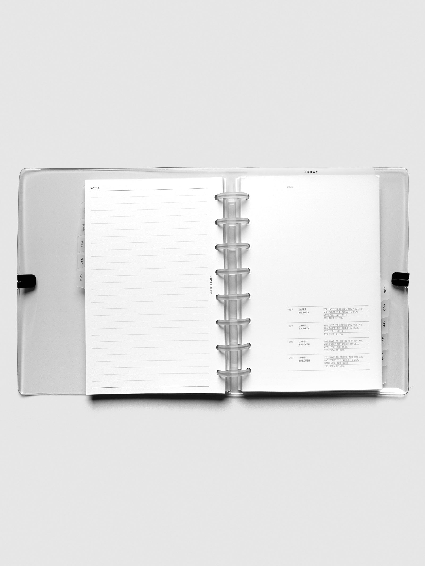 2026 Dated Planner Bundle Horizontal Weekly Monday Start in size Half Letter shown open in a Clear Vinyl Planner Cover.