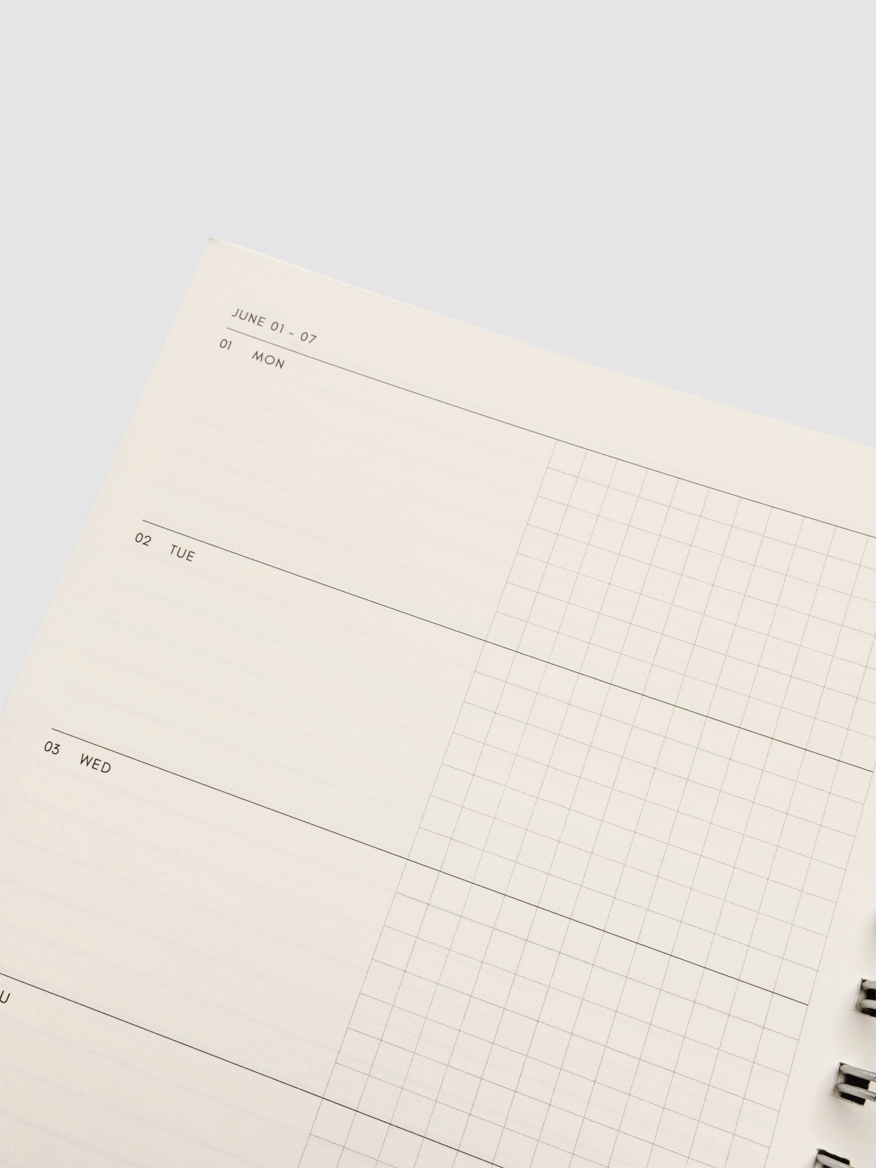 Close up of the inside of the 2026 Weekly Horizontal Notebook | Monday Start | A5 Spiral on a weekly layout spread showing blank space on the left hand side and graph notes on the right hand side for each day of the week.