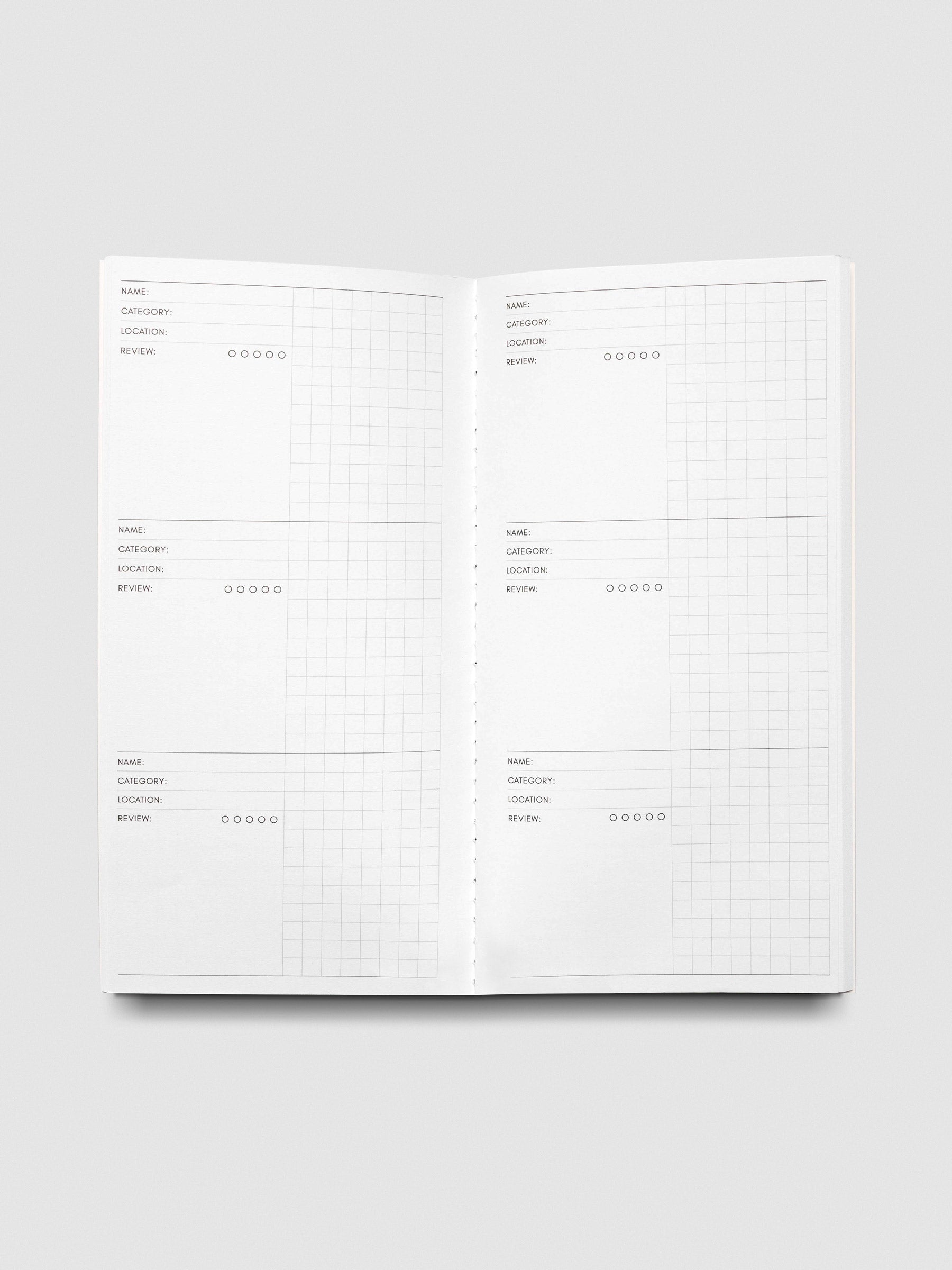Travel Notebook A5 Slim Experience Tracker open interior spread showing name category location and review fields with grid paper