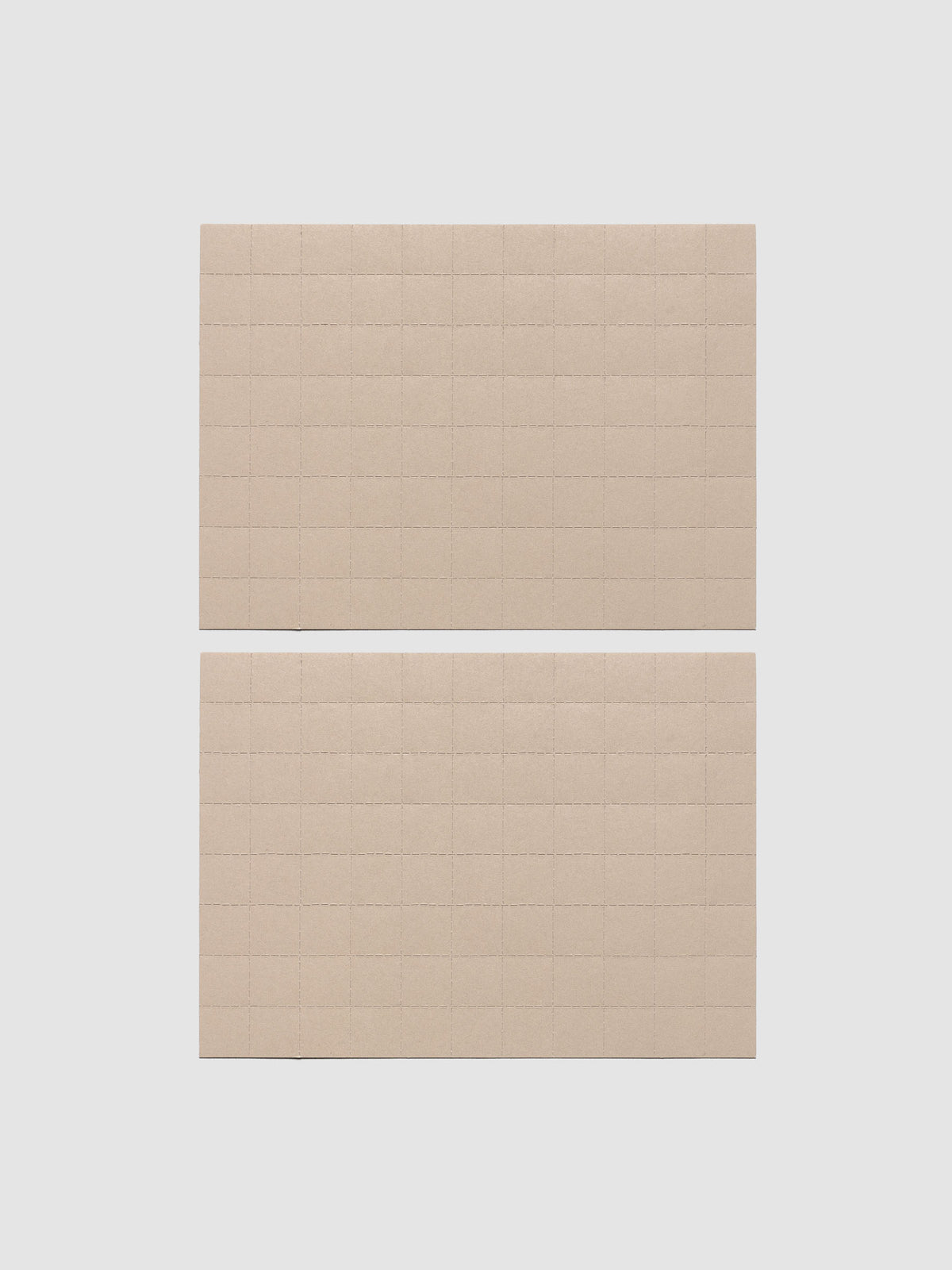 Two sheets of beige tear-off stickers