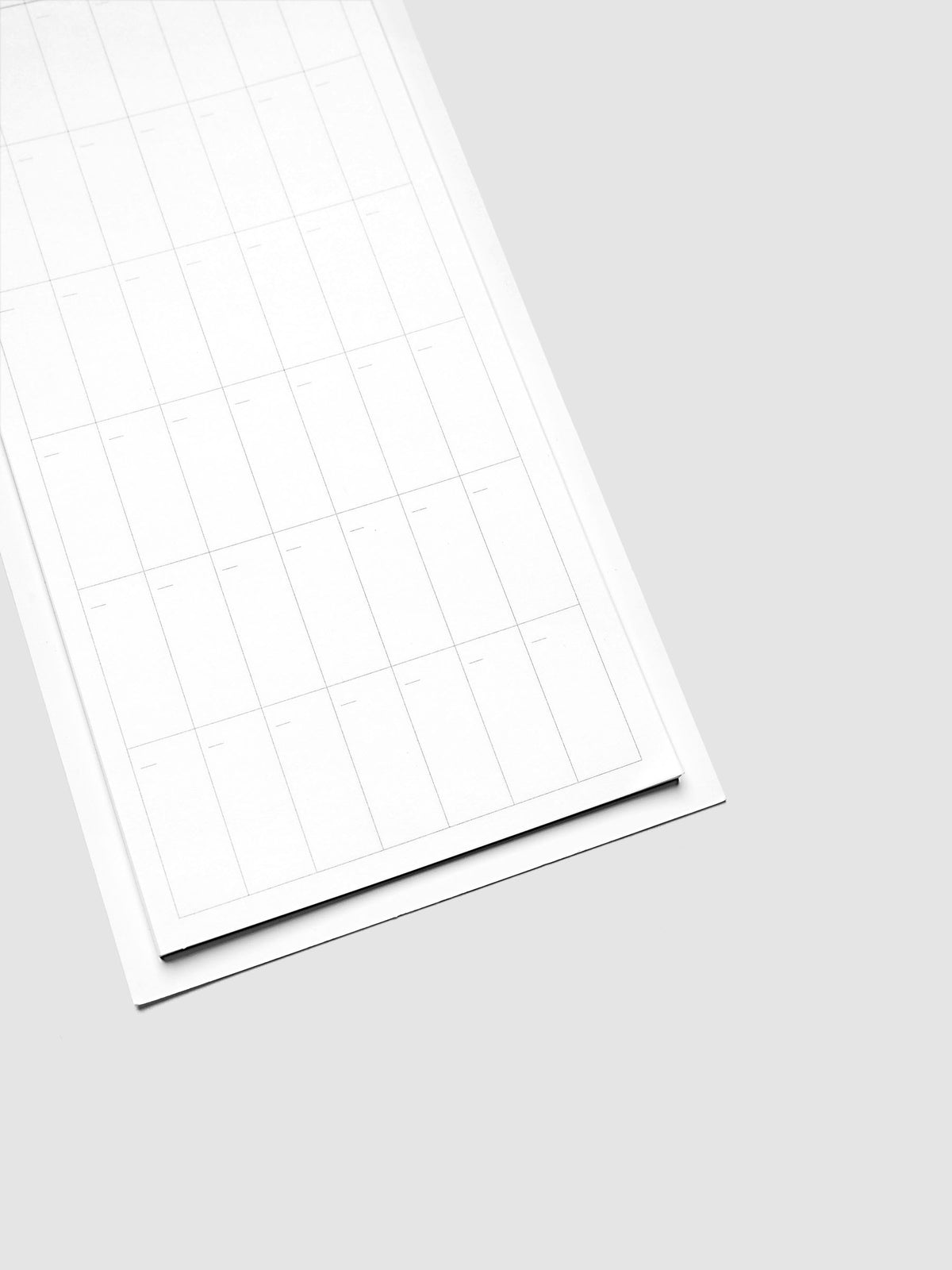 Bottom detail of monthly calendar sticky note showing date grid and footer area