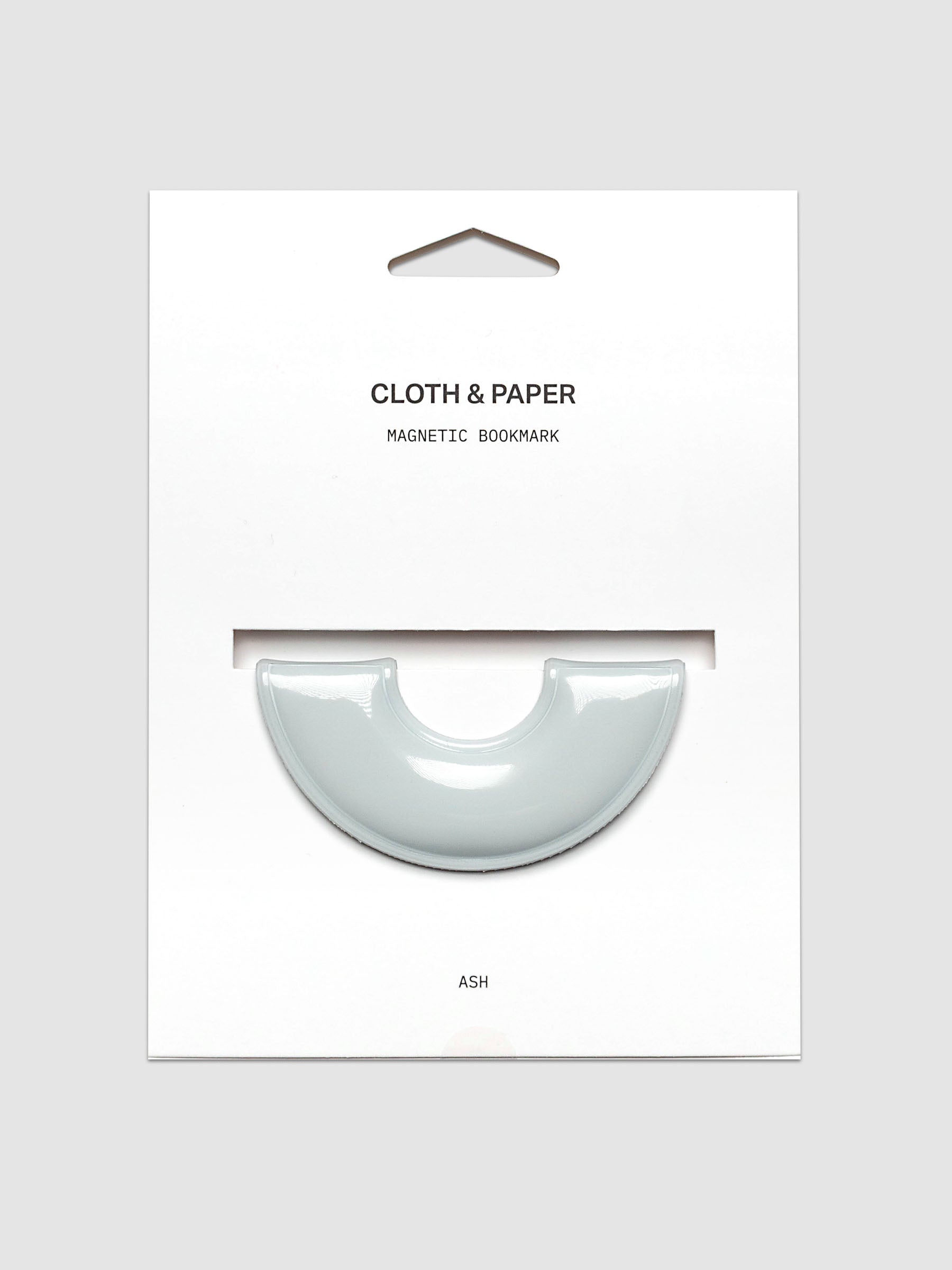 Magnetic Bookmark | Spotlight in the color Ash, a light grey, shown on a backing card