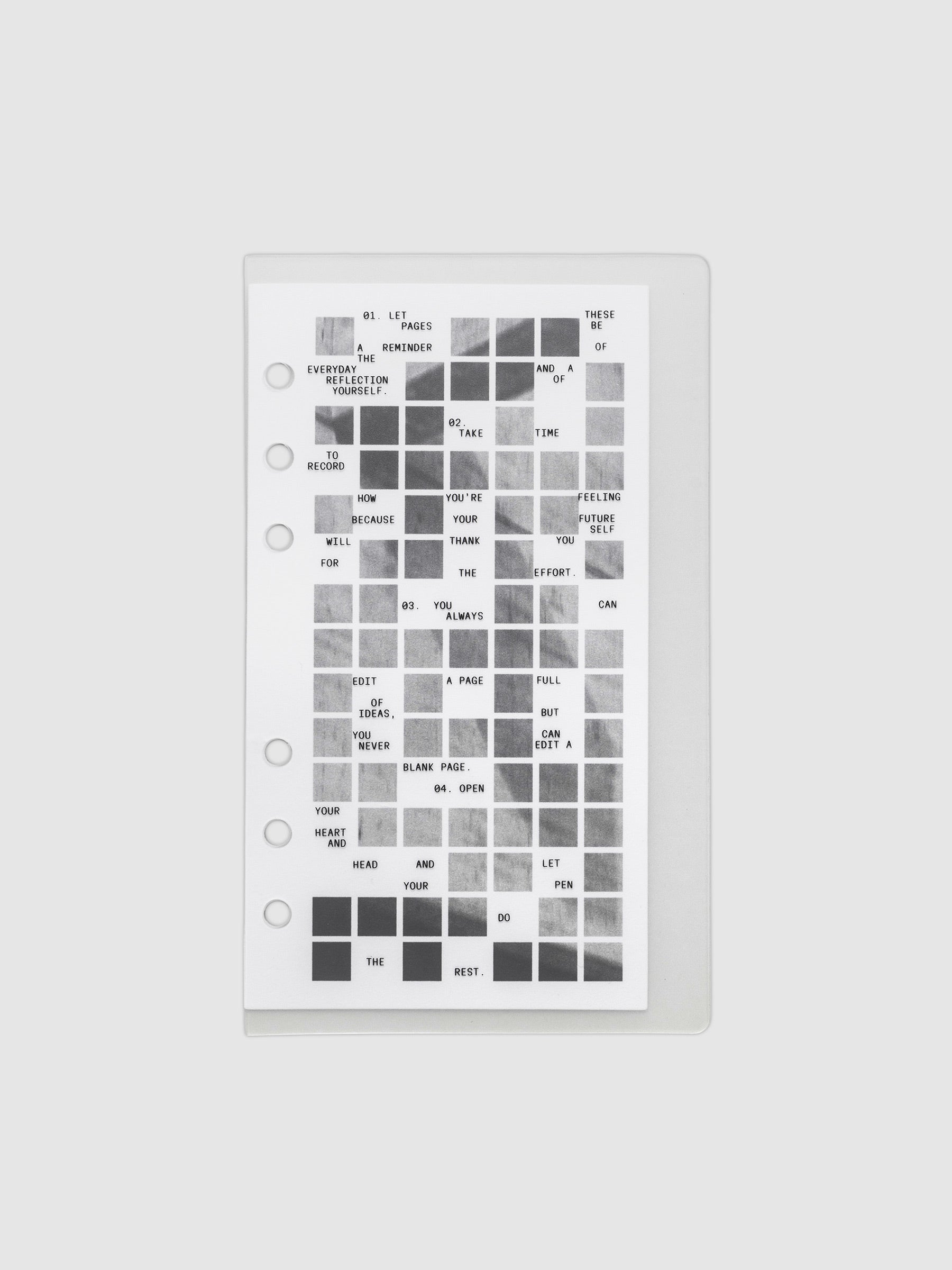 Clear planner cover with black printed text paired with a photographic black and white dashboard. Shown pre-punched for 6-ring planners in the size Personal.