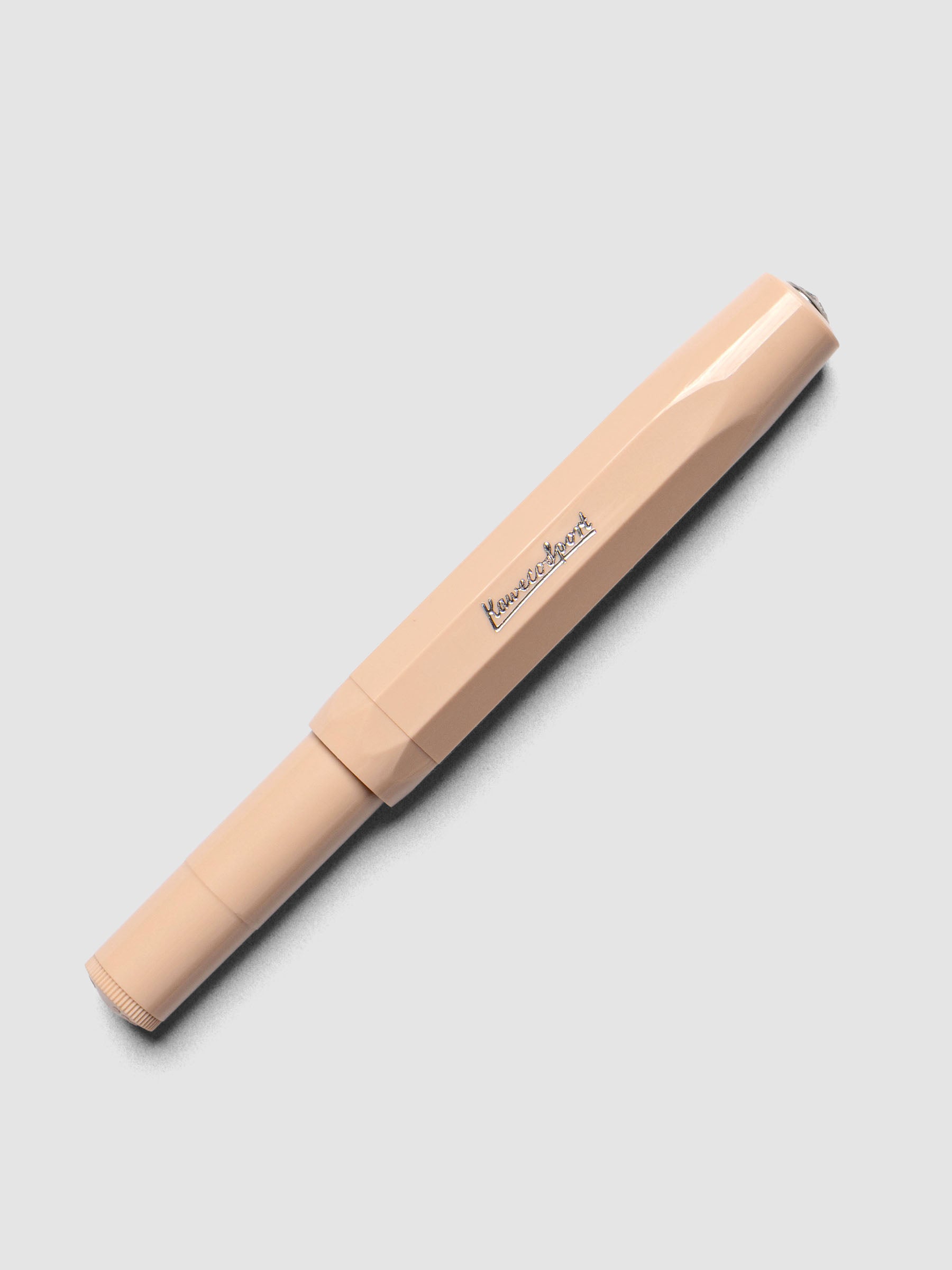 Warm beige rollerball pen shown capped.
